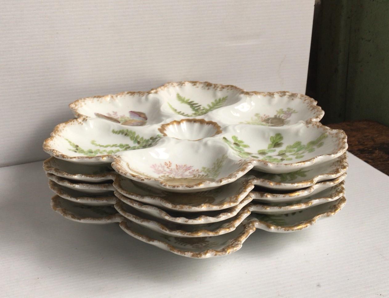 Porcelain oyster plate with seaweeds, crabs and shells Limoges, circa 1900.