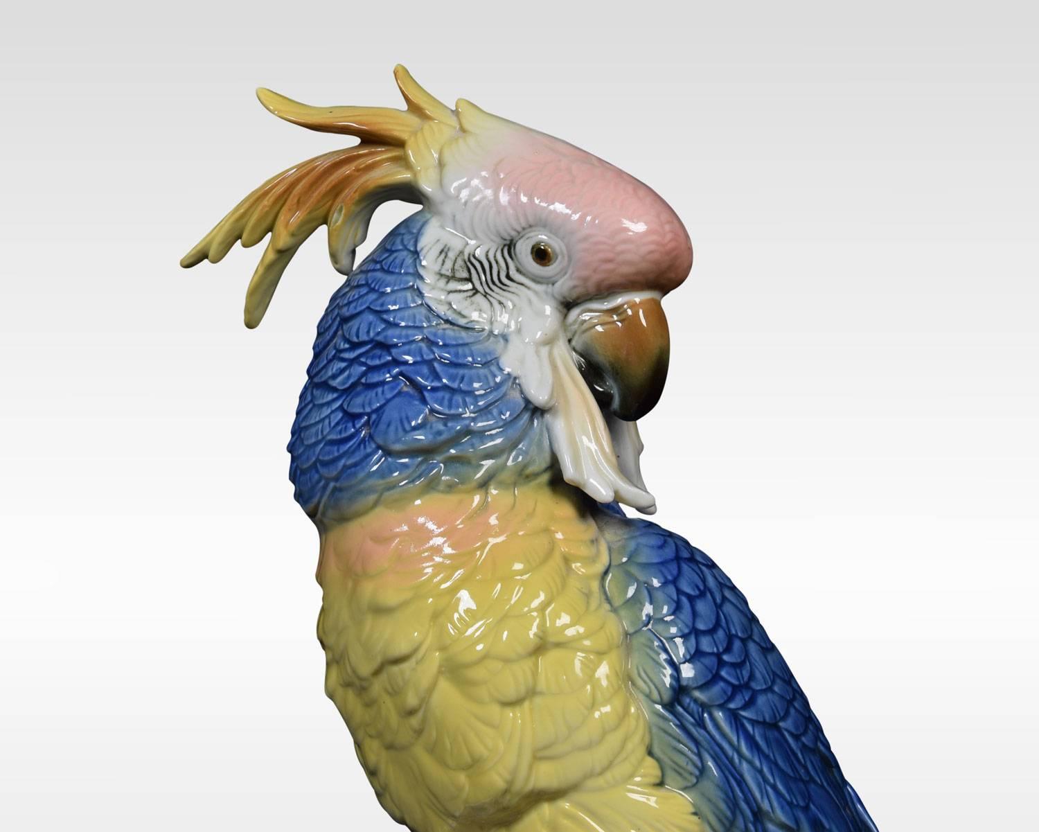 A mid-20th century German porcelain parrot by Karl Ens. The colorful parrot figure is perched on a white tree branch markings underneath.
Dimensions
Height 13 inches
Width 7.5 inches
Depth 6 inches.