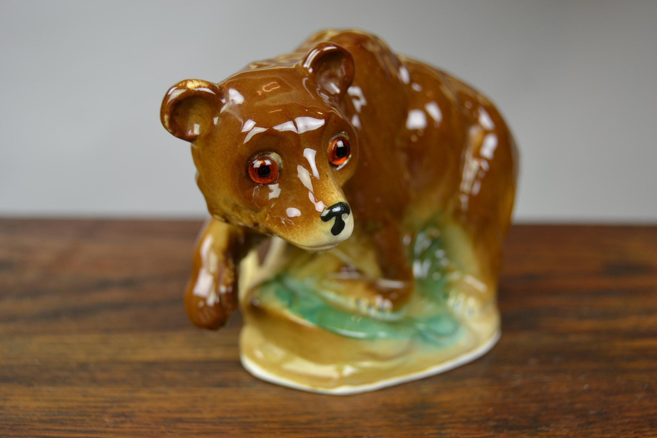 Porcelain perfume lamp in the shape of a brown bear - porcelain bear sculpture with light inside.
This wild animal figurine - animal statue dates circa 1930-1940. 
The plug has already been renewed. 

Perfume lamps were used to camouflage bad smell