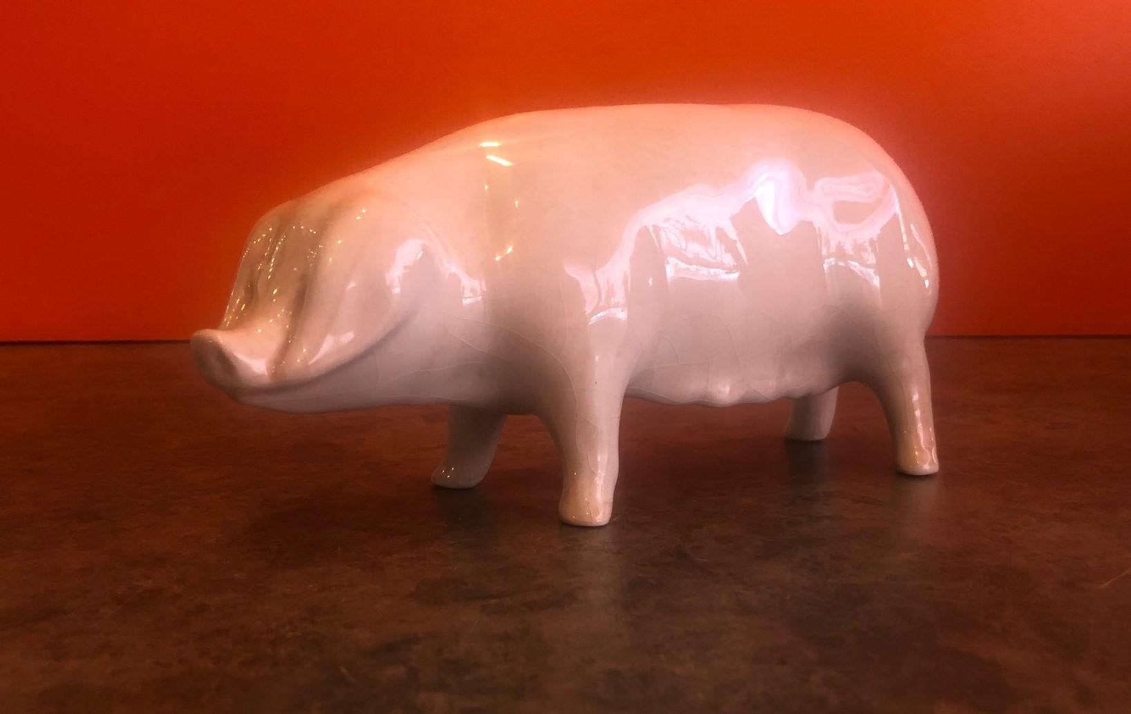 Whimsical porcelain piggy bank by Bovey Pottery of Devon, England, circa 1930s.