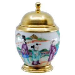 Porcelain pot w/ scenes from Japanese daily life w/ a gilded silver base 
lid