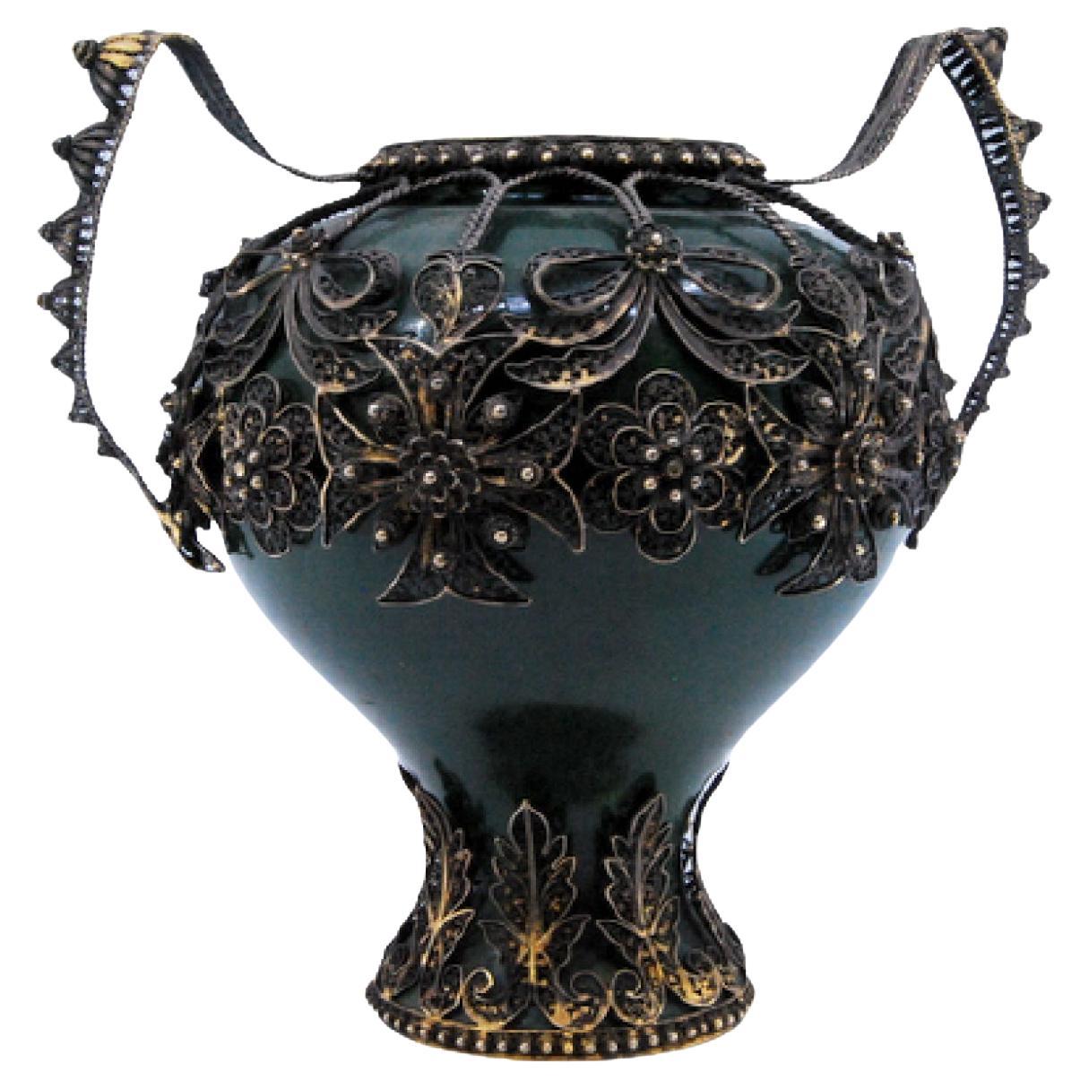 Porcelain pot with filigree silver applications and two handles