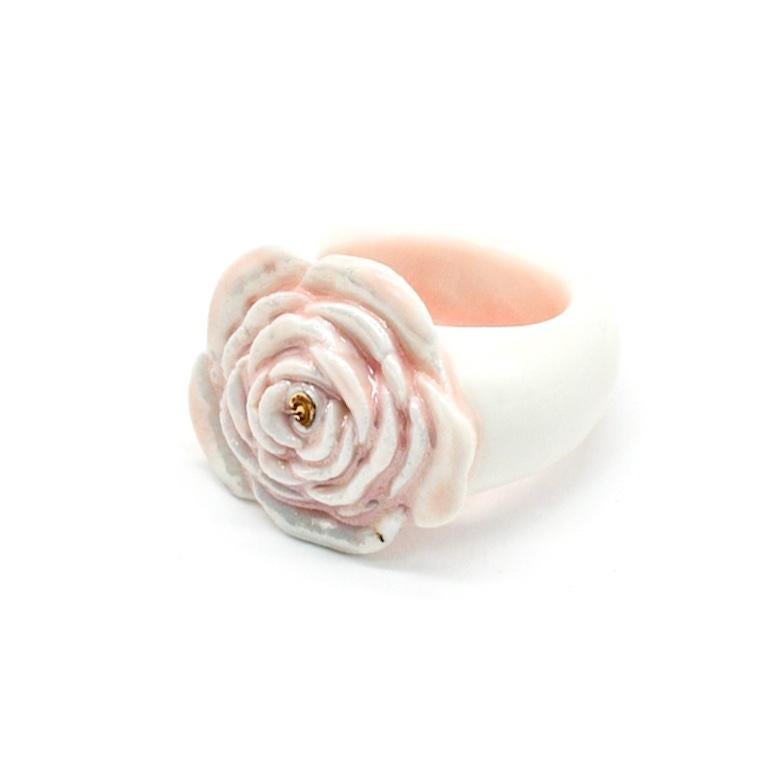 Porcelain  Mother of pearl  24K gold  Handmade in London

Indulge in luxury with our SABRINA Porcelain Ceramic Ring. Handcrafted from the whitest porcelain and adorned with a delicate pink glaze, this ring exudes femininity. The intricate and