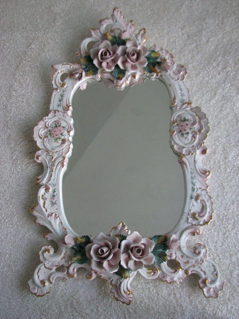 An unusual, porcelain (!) Rococo wall console with a hanging mirror.

It delights with both the richness of the rocaille ornament and additional floral decorations (flowers), as well as the office condition in which the item has survived, despite