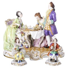 Porcelain - Sculptural group and pair of figures