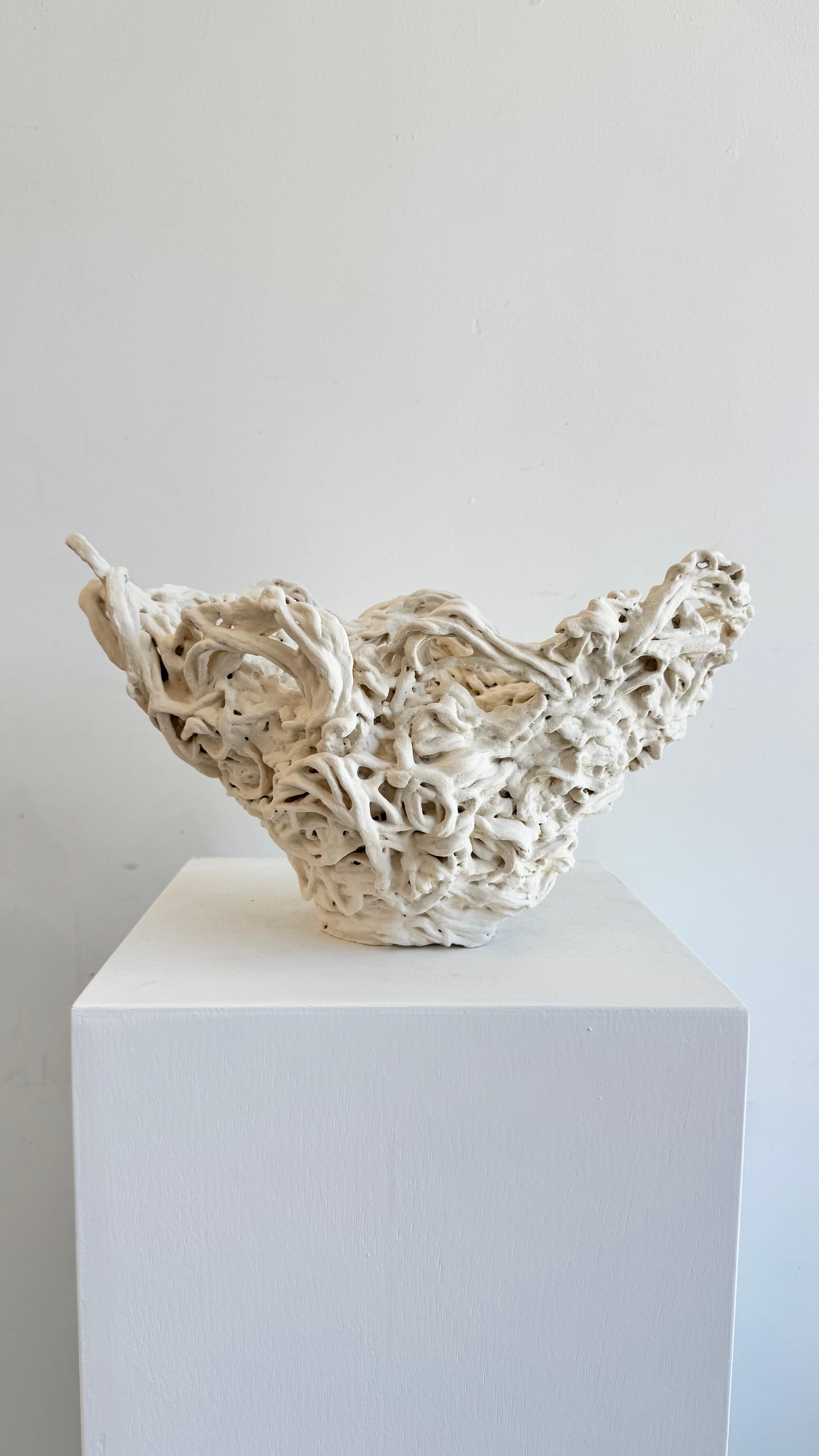 Charlotte is a one of a kind porcelain hand built sculpture. She is heavily textured with folds and crevices that make her mysterious and enticing with a different presence at each turn of her.

*Porcelain
*Handbuilt, 
*Handwash, doesn't hold water,
