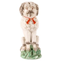 Antique Porcelain sculpture of a Poodle dog, England 1900. 