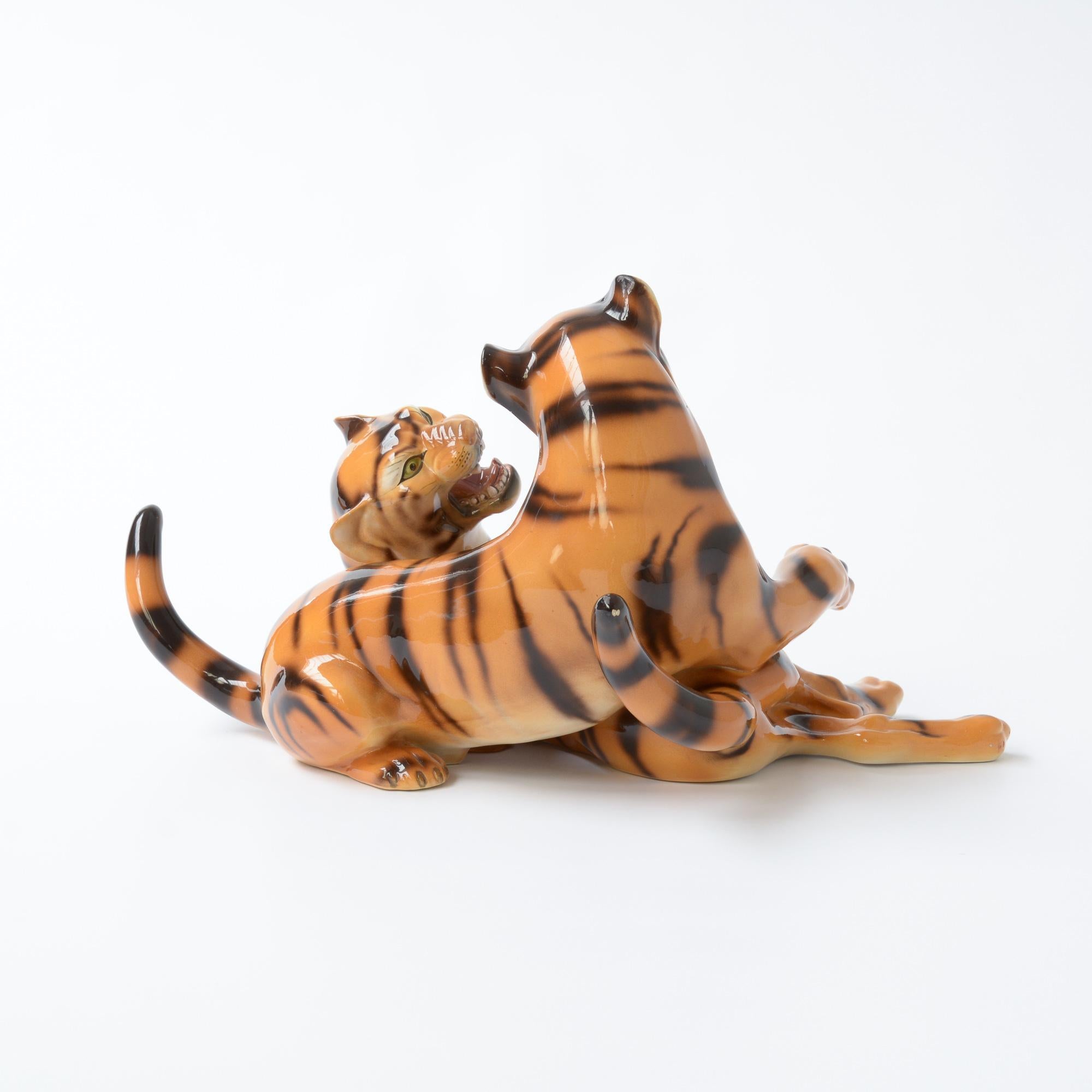 This porcelain sculpture of playing tigers is made by the Italian artist Ronzan. It can be dated in the 1950s.
Giovanni Ronzan and his brother founded the Ronzan factory circa 1940s shortly after he had left his job as chief painter and ceramic