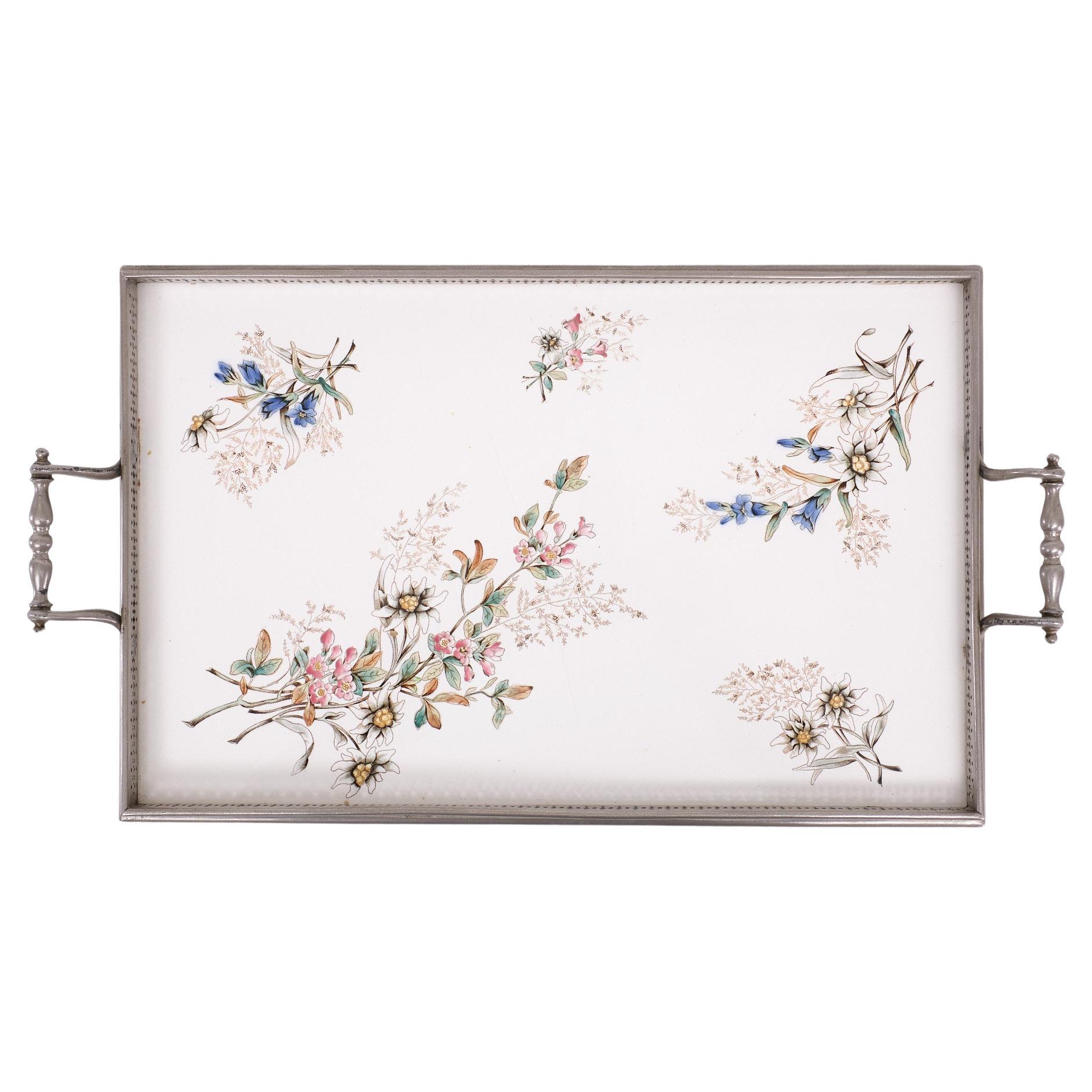 Very nice Porcelain serving tray .Decorated with Flowers .Standing  on 
White Metal feet . And hand grips . So elegant 