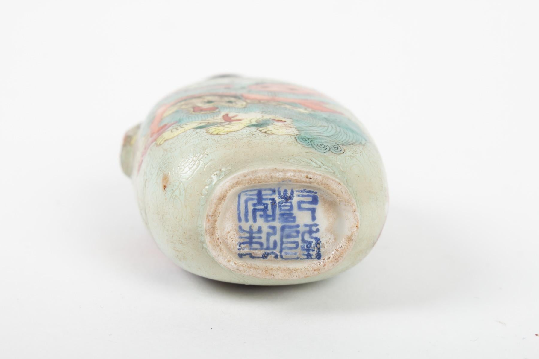 Porcelain Snuffer with Four Shishi Decor Facing Among Clouds on Celadon Backgrou 1