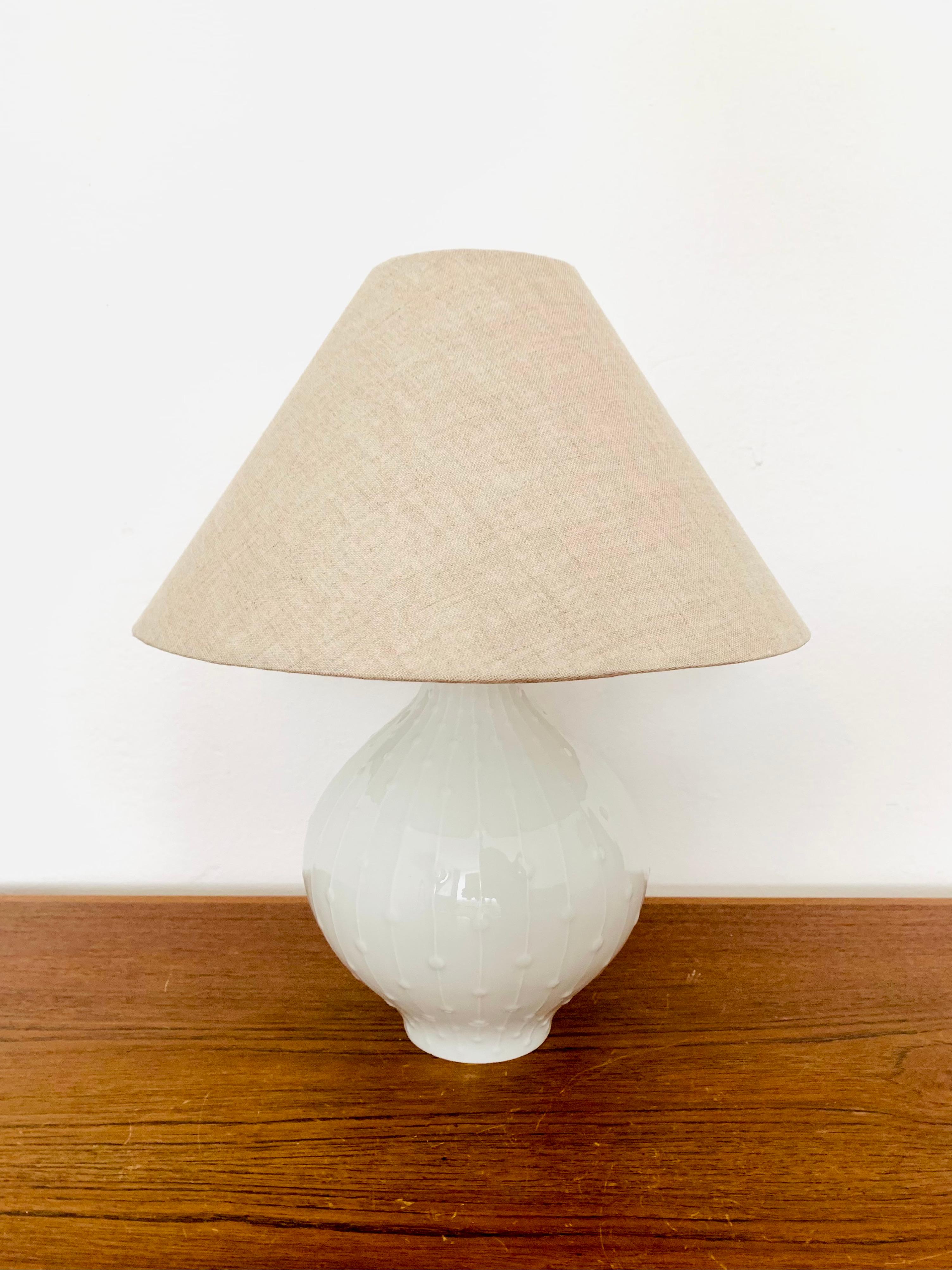Impressive porcelain table lamp from the 1960s.
Extremely high -quality workmanship and very nice design.

Manufacturer: Hutschenreuther art department

Condition:

Very good vintage condition with minimal signs of wear.
The lampshade is new.

The