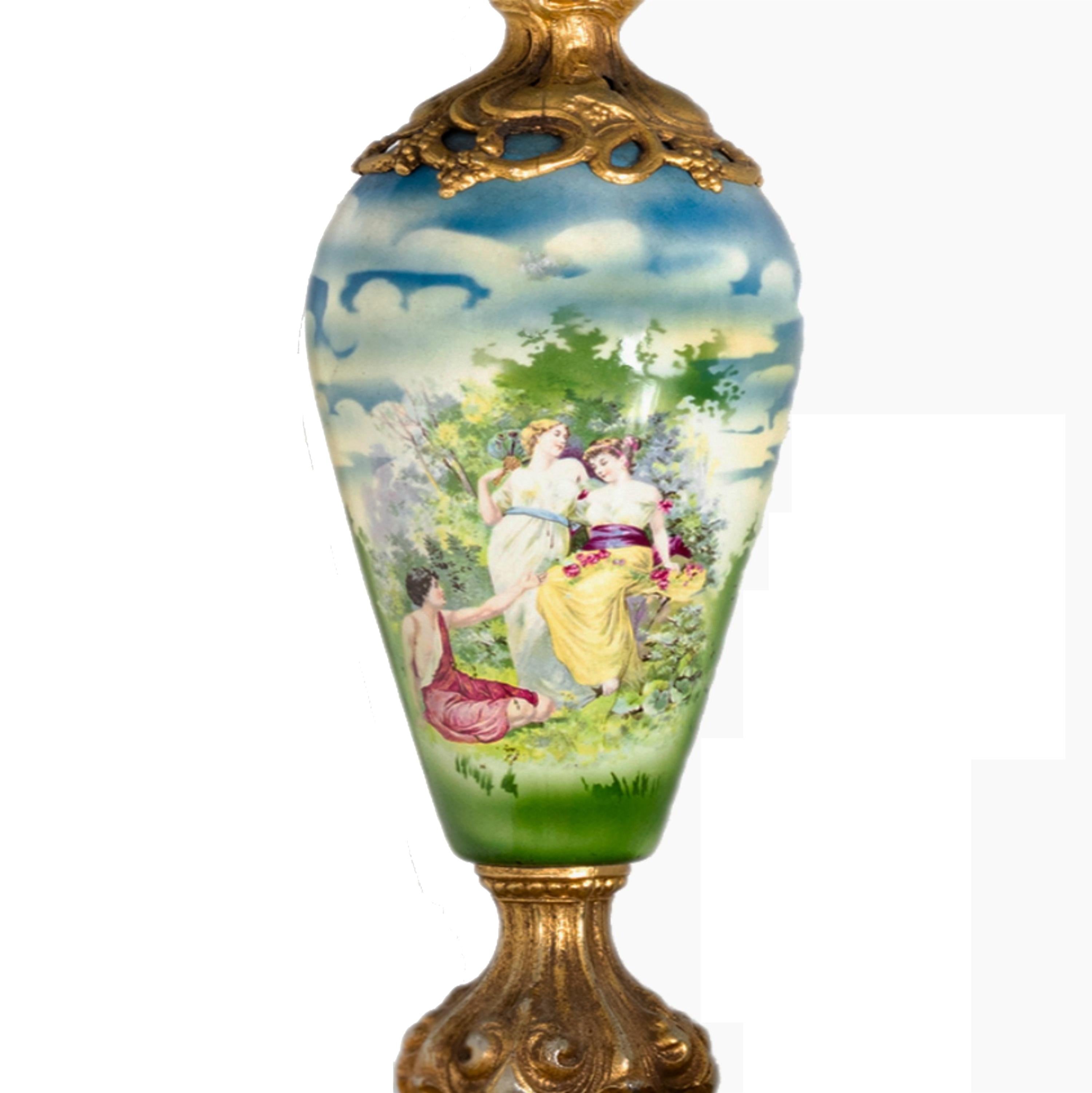 A Napoleon III Sevres styled table lamp with painted porcelain with gallant nymphs in the garden, gilded bronze and letterhead in the spirit of the Baroque Revivalist style of the 1900s

height with lampshade: 68 cm
height without lampshade: 48 cm