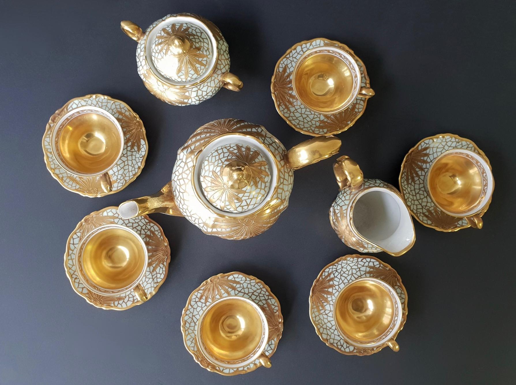 Porcelain gilt tea or coffee set by Greiner for Heinrich in Selb, Bavaria, Germany. 
White and gold hand painted.