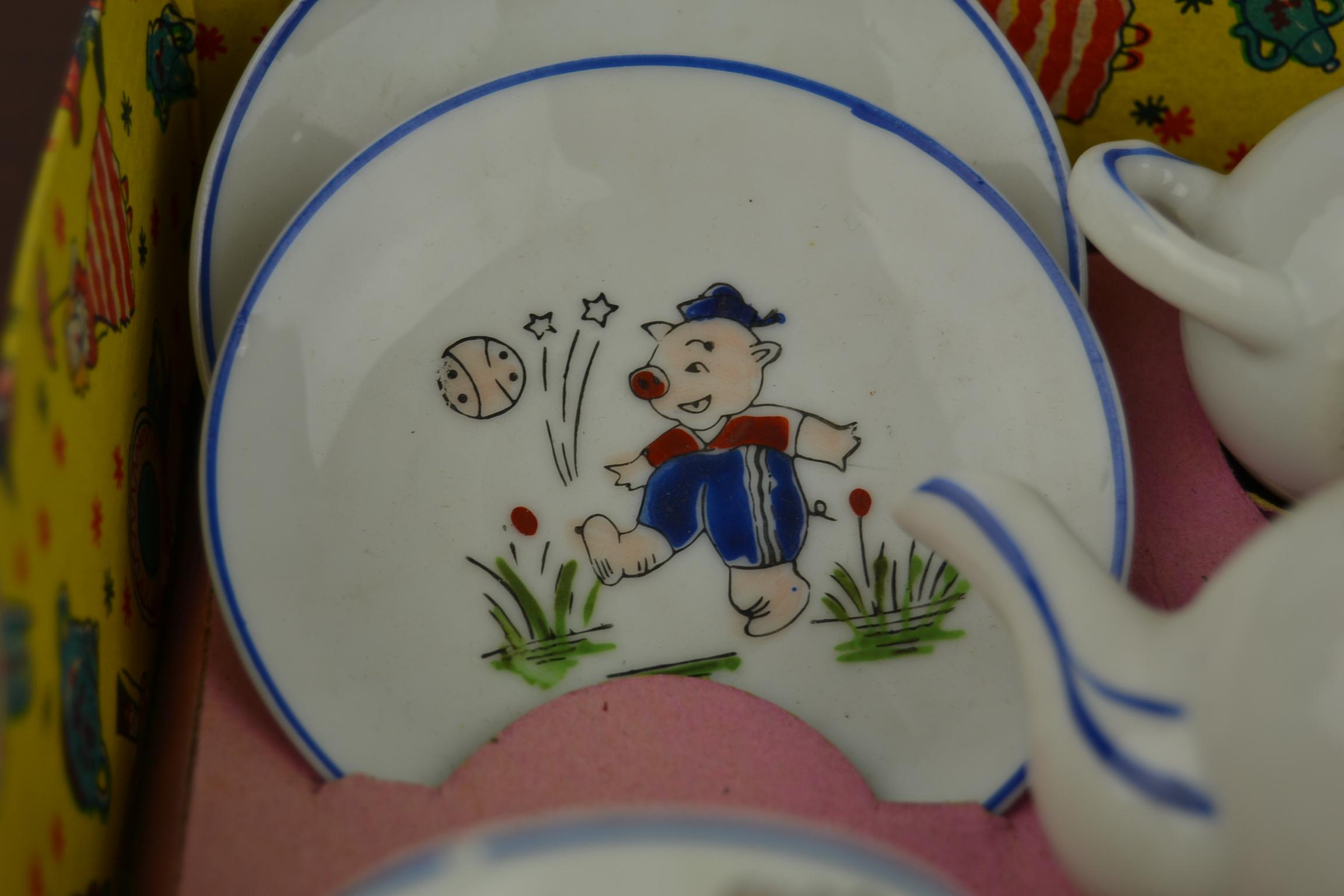 Vintage children's tea set - toy tableware set - miniature tea set with a pig playing football.
This porcelain set exists of four cups with saucers, teapot with cover, covered sugar bowl and milk jug.
This toy set is complete and displayed in his