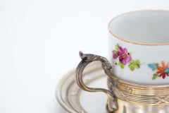 Porcelain teacup with silver saucer