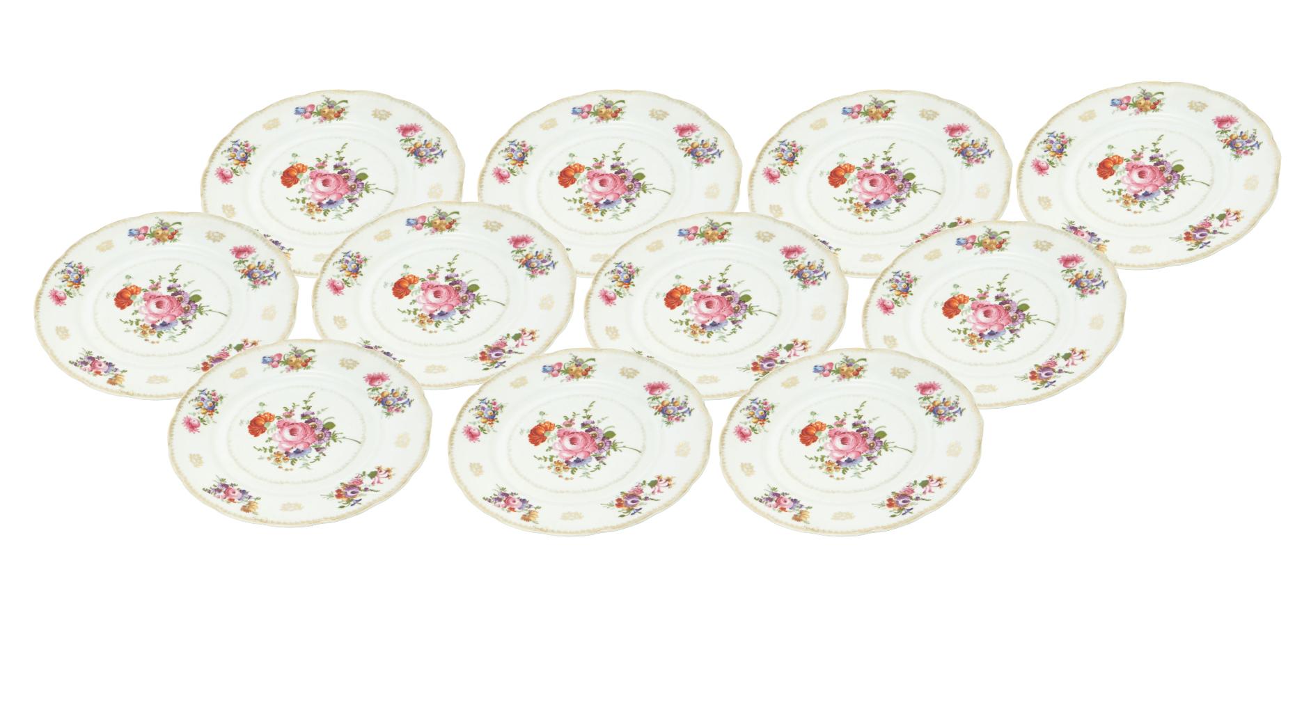 Dine in timeless elegance with our Porcelain Painted and Gilt Floral Bouquet Decorated Set of Eleven Dinner Plates, a stunning creation from the mid-20th century by Coronet Chinaware Co in the Czech Republic. Each plate is a masterpiece, featuring a