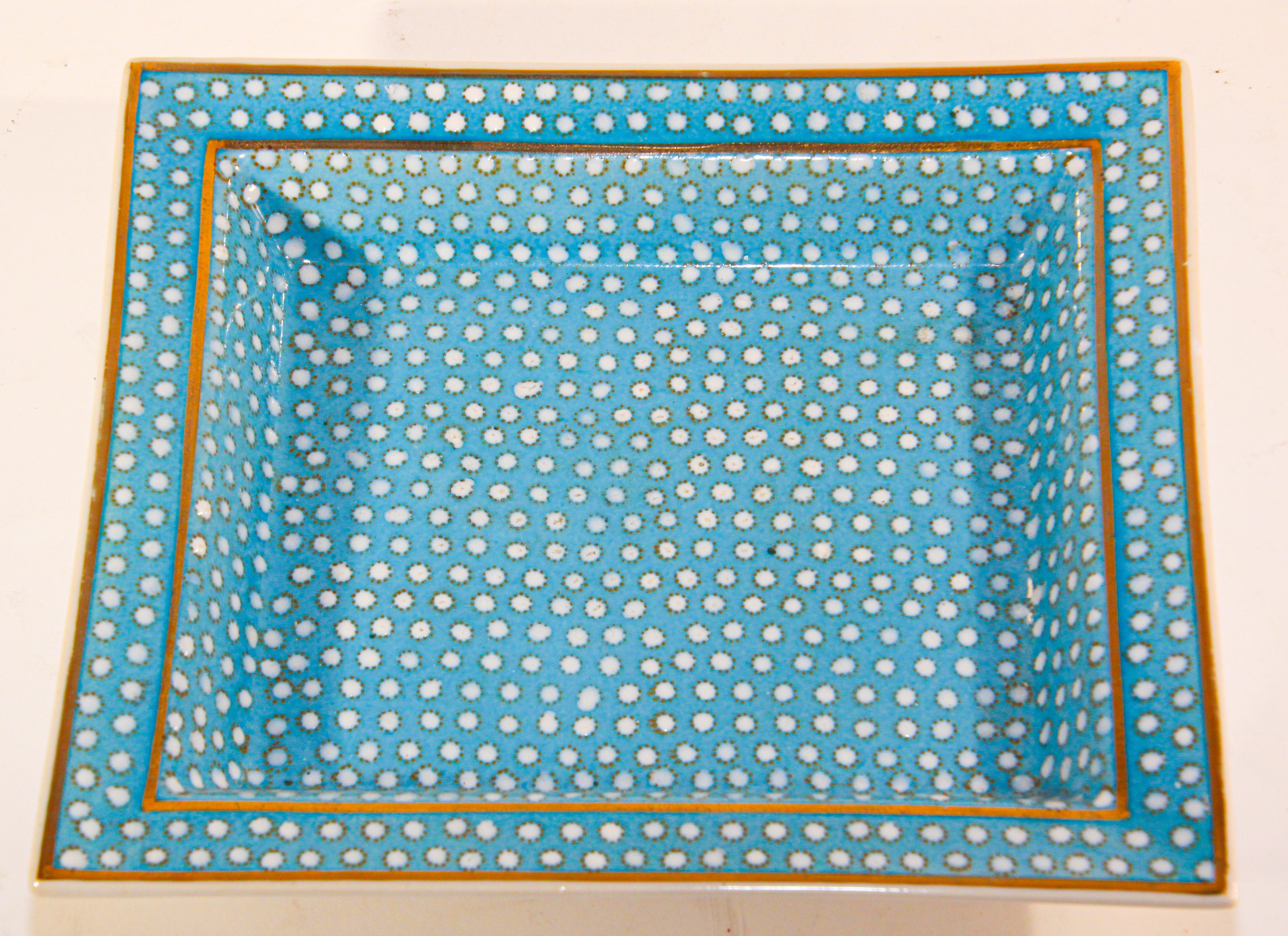 Porcelain small catchall trinket tray with turquoise and white dots and gold rim.
This lovely vide poche, porcelain trinket dish, change tray features white fine bone china decorated with a turquoise and gold border and white