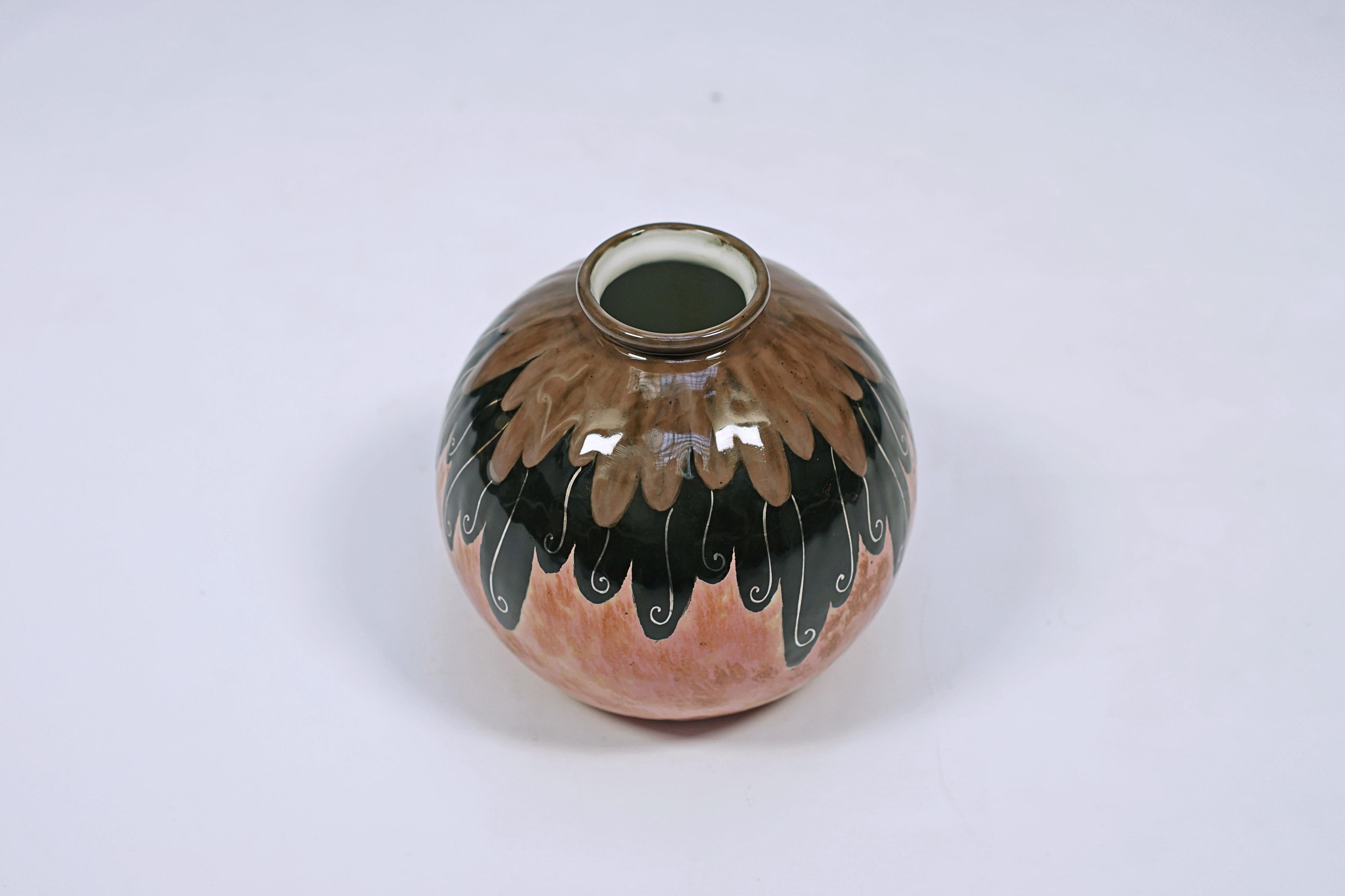 Enamelled porcelain vase with a design of circular brushstrokes and arabesque details. Designed by THARAUD Camille (1878-1956), made by Limoges. Signed Limoges, France, C THARAUD.

France, CIRCA 1940.