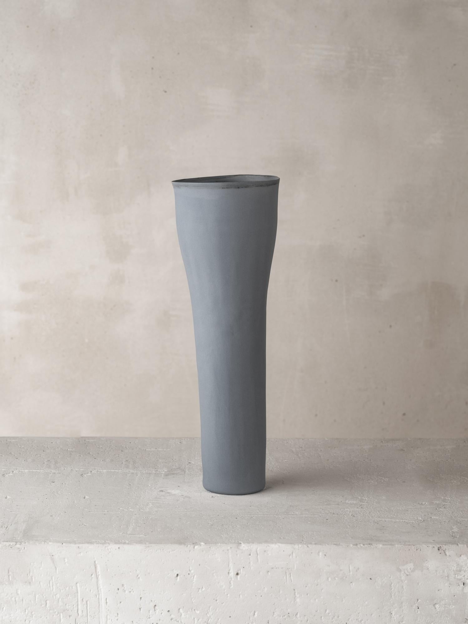 Materials: Cast Porcelain with Colored Oxide

For over forty years Katherine Glenday has been creating meditative ceramic and porcelain pieces by hand in her South African studio. Remarkable in their translucency and luminosity, the porcelain vessel