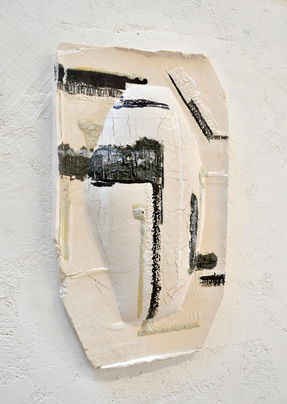 This ceramic wall sculpture by Kathryn Robinson-Millen is hand-built in porcelain paper-clay from a drop mold slab construction. The piece is reduction fired. It is a stunning and unusual wall piece.

The porcelain slab was painted in areas with