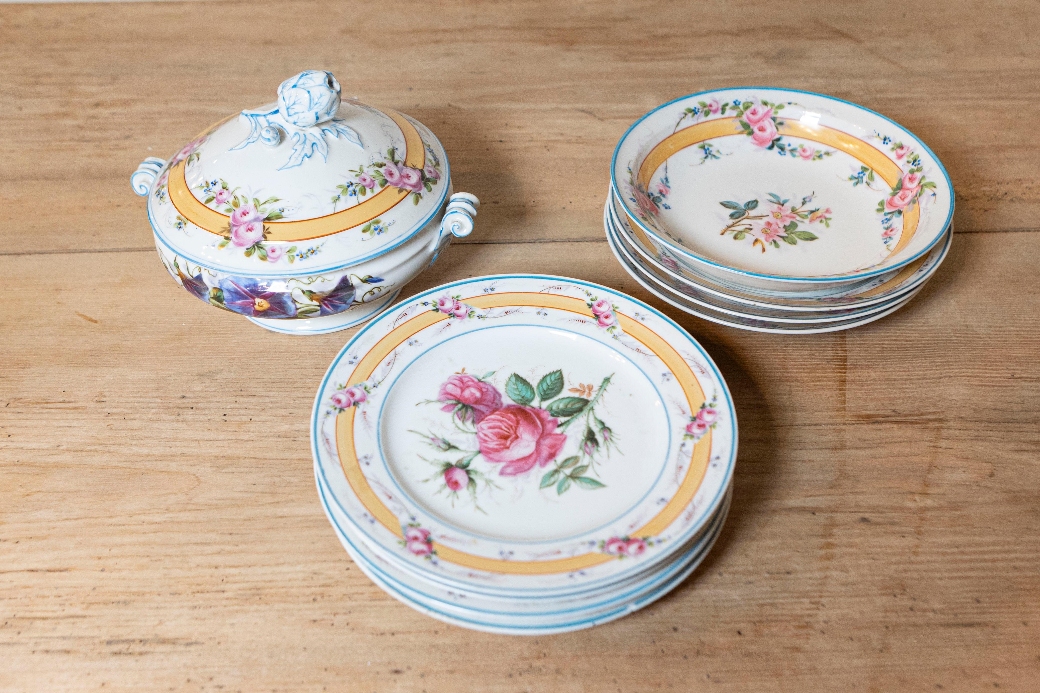 A Porcelaine de Paris dish set from the 19th century, with floral décor. Created in France during the 19th century, this Paris Porcelain dish set attracts our attention with its delicate décor showcasing a flower in each plate's center, surrounded
