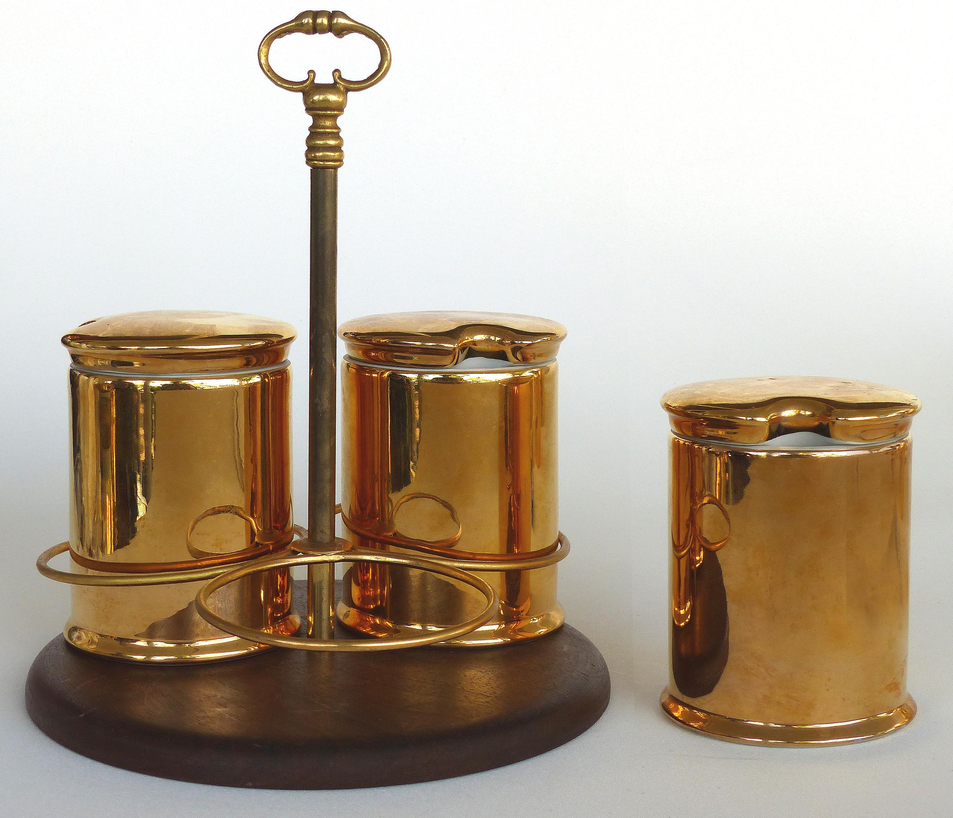 Porcelaine de Paris Gold Lustre Lidded Condiment Jars and Stand

Offered for sale is an unusual set of porcelain de Paris Gold Lustre lidded condiment jars and stand, the jars are fully marked and retain their lids. The stand is easily carried with