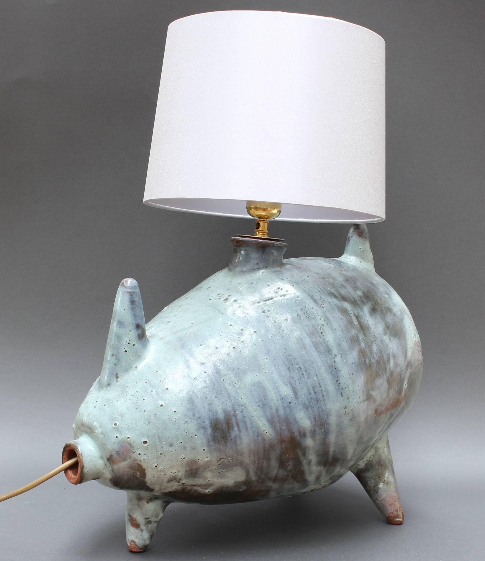 Porcine ceramic table lamp, (circa 1960s). A very tactile and visually intriguing glazed ceramic porcine table lamp on three legs - an instant conversation piece. The Verdigris matte finish will complement your spaces' colour schemes and the size