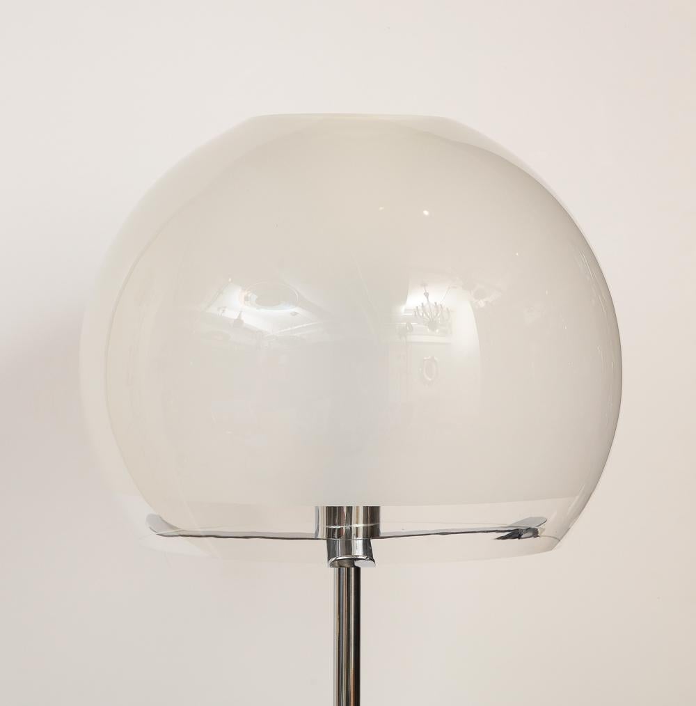 Enameled metal, chromed metal, glass. A fantastic and rare model. Dark gray painted metal base with a frosted glass sphere concealing 4 x E26 sockets. Chromed stem at the top of the base has an adjustable height mechanism.