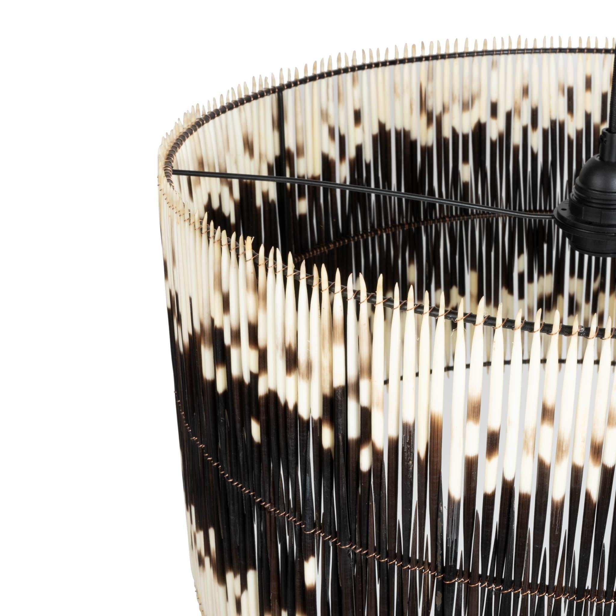 Sustainably sourced porcupine quills are bound together to create this light fixture's striking drum shade. Because of the organic nature of the materials, no two pendants are exactly alike.

PRODUCT INFORMATION
DIMENSIONS: 20