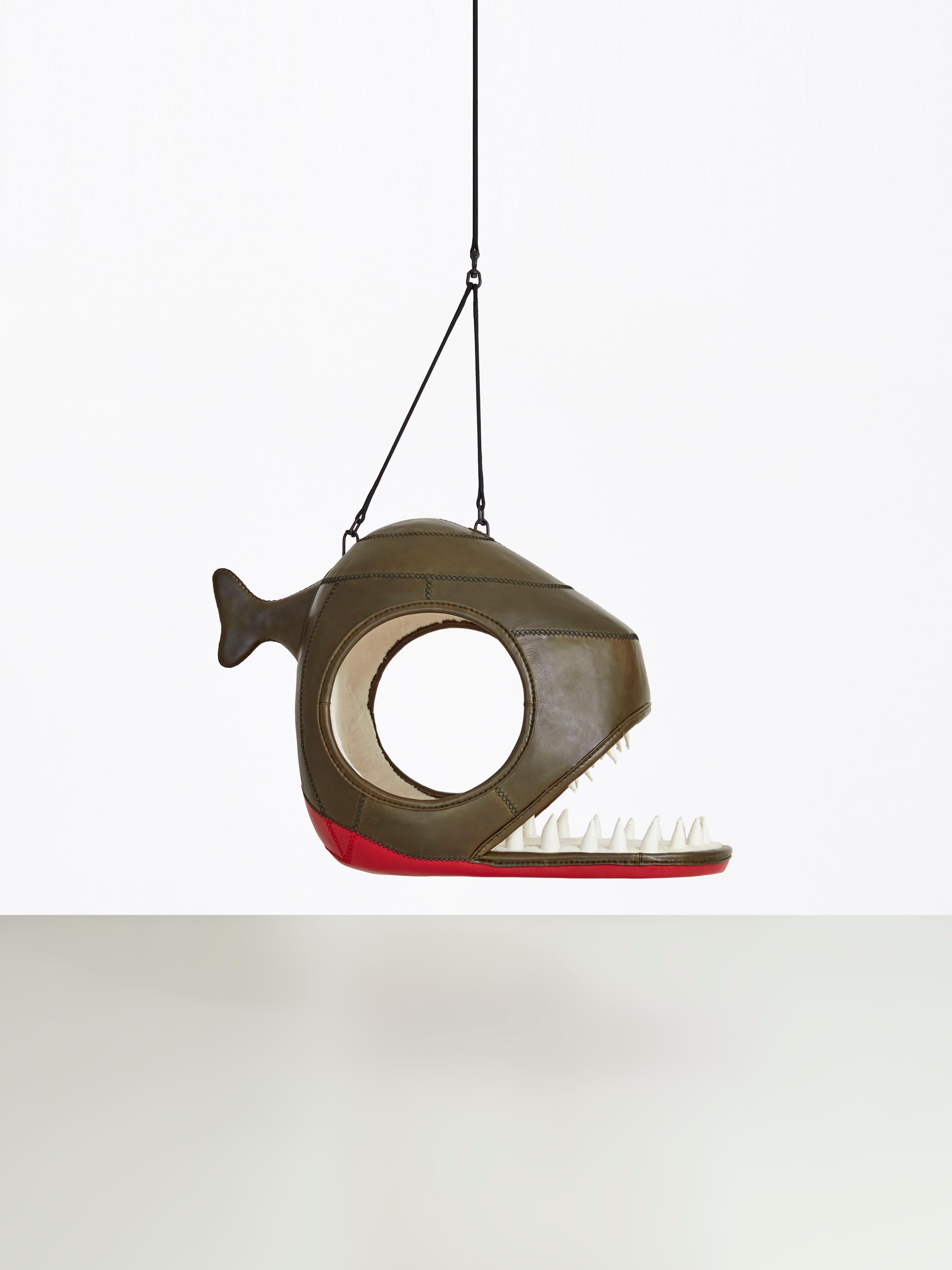 Porky Hefer’s menagerie of sculptural seating pods have become renowned and recognisable forms in the global design landscape. Here, Hefer’s design takes the form of a gargantuan piranha. Beyond the bared, leather teeth of the fish’s gaping mouth,