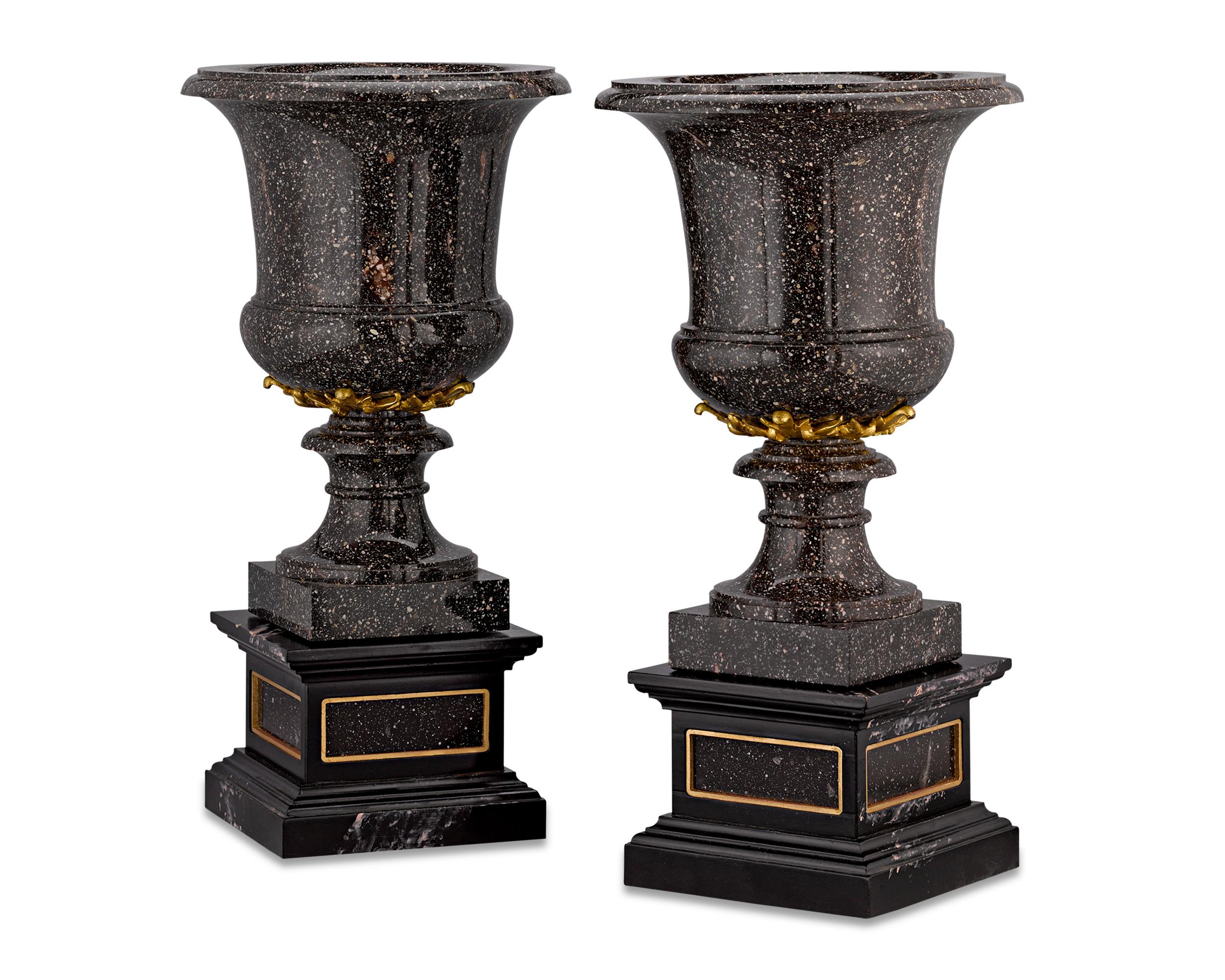 These impressive Blyberg porphyry vases demonstrate the strength and beauty that has made porphyry a prized material since antiquity. Porphyry is renowned not just for its regal red or purple hue, but also its incredible hardness, making the