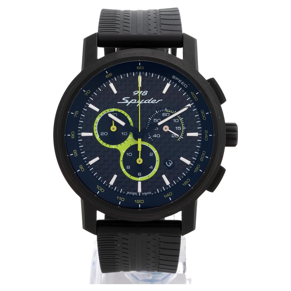Our Porsche Design 918 Spyder quartz chronograph reference wap0700810e features a black steel 44mm case, and carbon effect dial with rubber tyre effect strap and folding clasp with security lock. The dial has acid green touches to the sub dil and