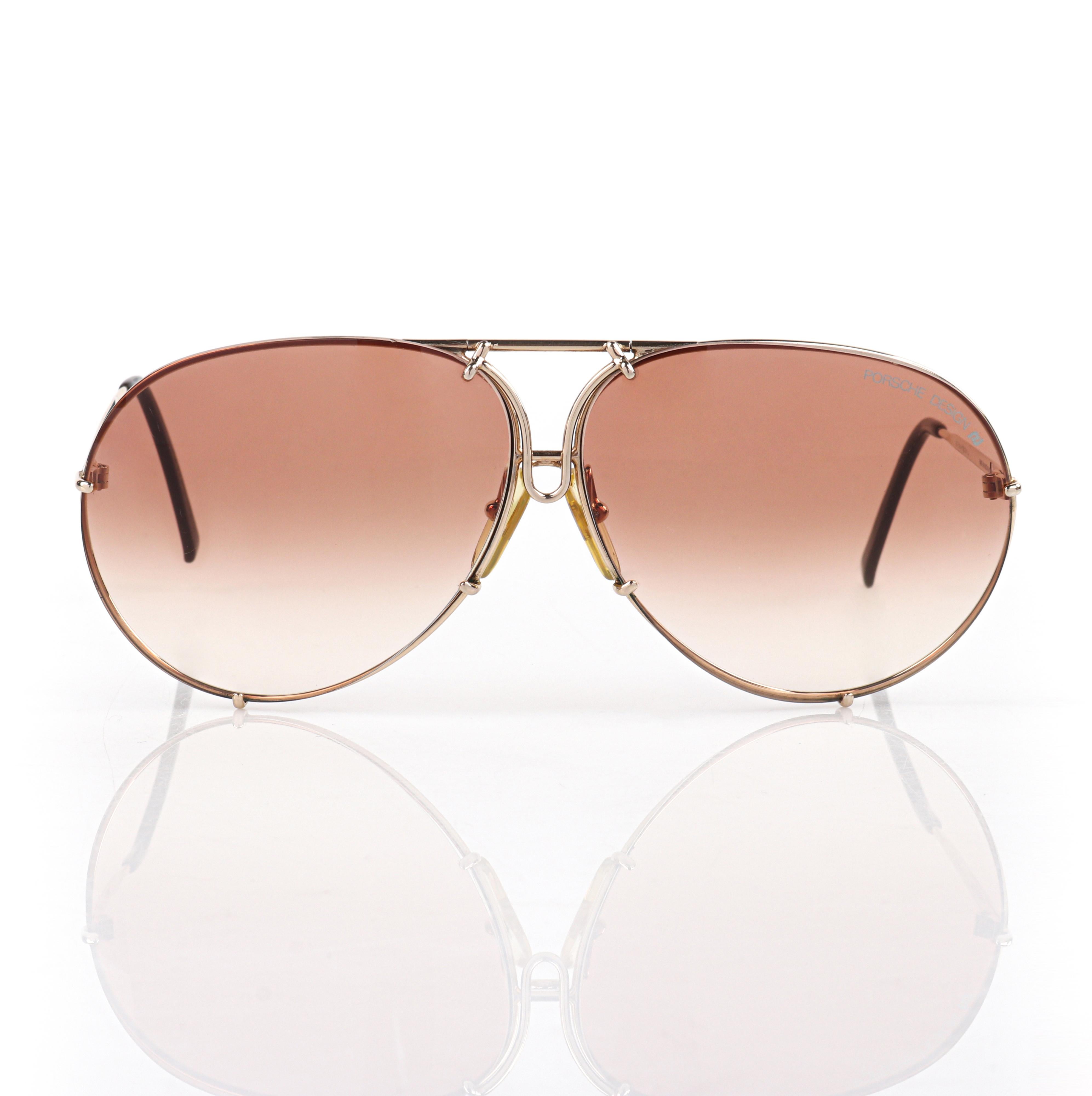 PORSCHE DESIGN BY CARRERA c.1987 Interchangeable Lens Aviator 5621 Sunglasses 
 
Brand / Manufacturer: Carrera Porsche
Circa: 1987
Manufacturer Style Name: 5621
Style: Aviator Sunglasses
Color(s): Shades of gold and brown
Lined: No
Unmarked Fabric