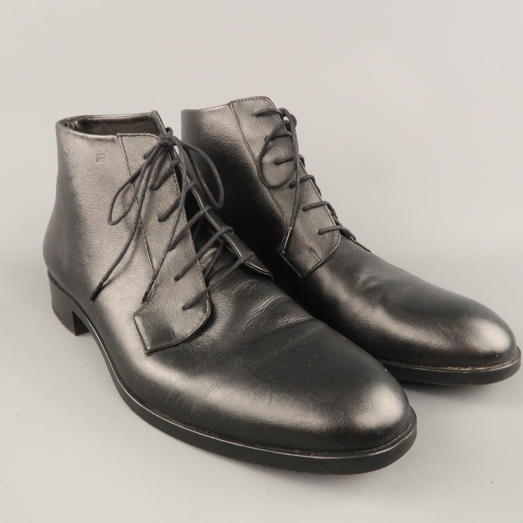 PORSCHE DESIGN desert boots come in textured leather with a rounded point toe, heeled sole, and lace up front. Made in Portugal.
 
Excellent Pre-Owned Condition.
Marked: 10.5
 
Outsole: 12 x 4 in.