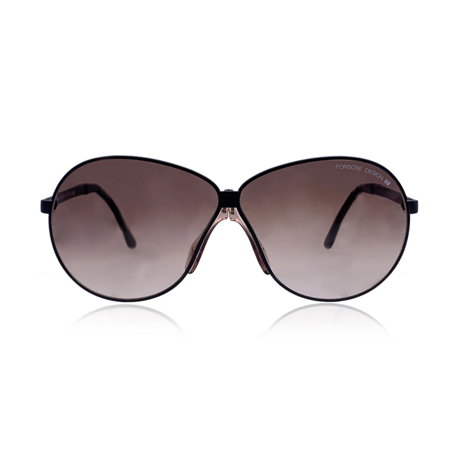 Vintage foldable sunglasses by Porsche Design mod. 5626. Black metal frame. Oversize design. Gradient brown lenses. Made in Austria

Details

MATERIAL: Metal

COLOR: Black

MODEL: Foldable 5626

GENDER: Unisex Adults

COUNTRY OF MANUFACTURE: