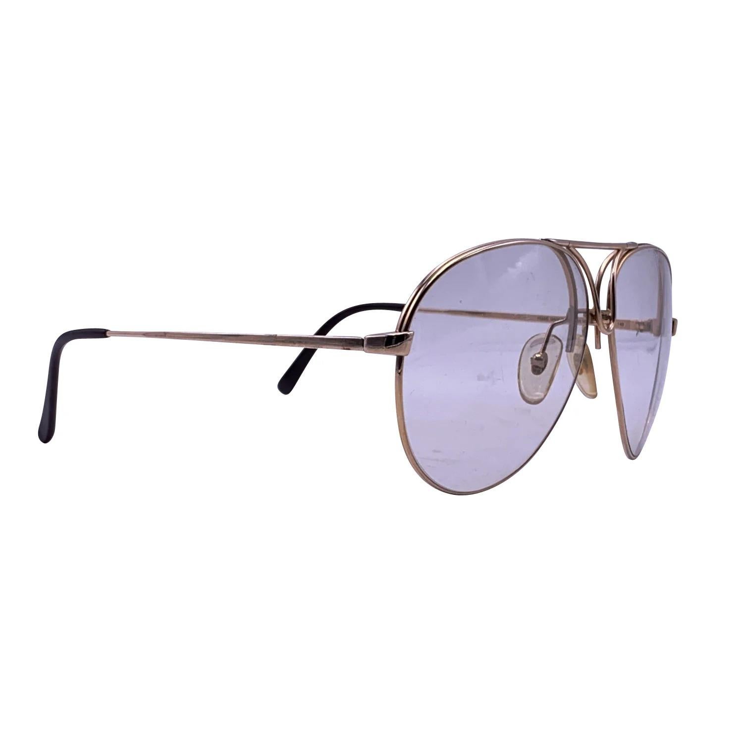 Vintage gold metal aviator eyeglasses by Carrera Porche Design, Mod. 5657.Clear demo lenses. Frame made in Austria. Details MATERIAL: Metal COLOR: Gold MODEL: 5657 GENDER: Unisex Adults COUNTRY OF MANUFACTURE: Austria ORIGINAL CASE?: No STYLE: Full