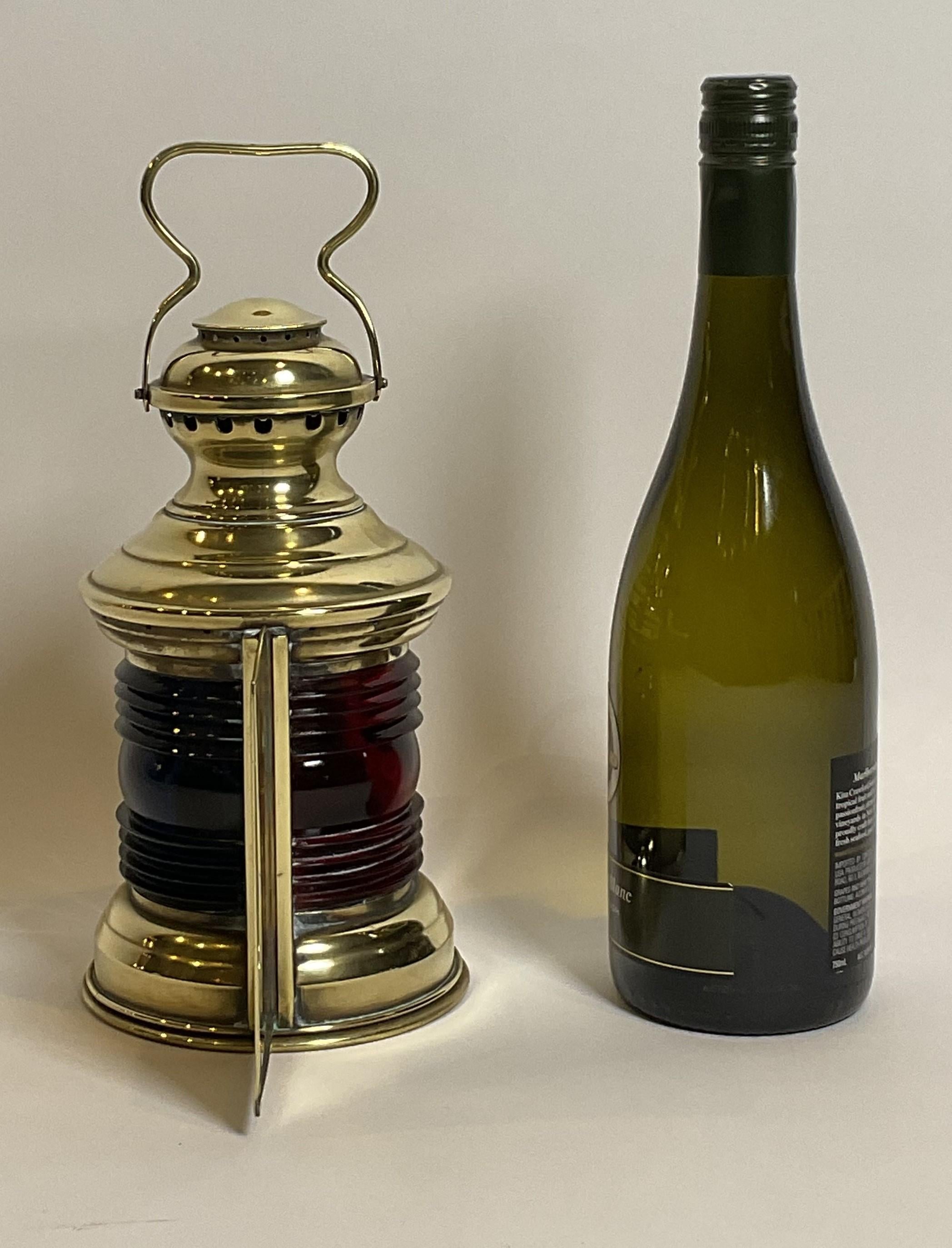 Solid brass bow lantern from a yacht or launch. With blue and red fresnel glass lenses. Rear is embossed 