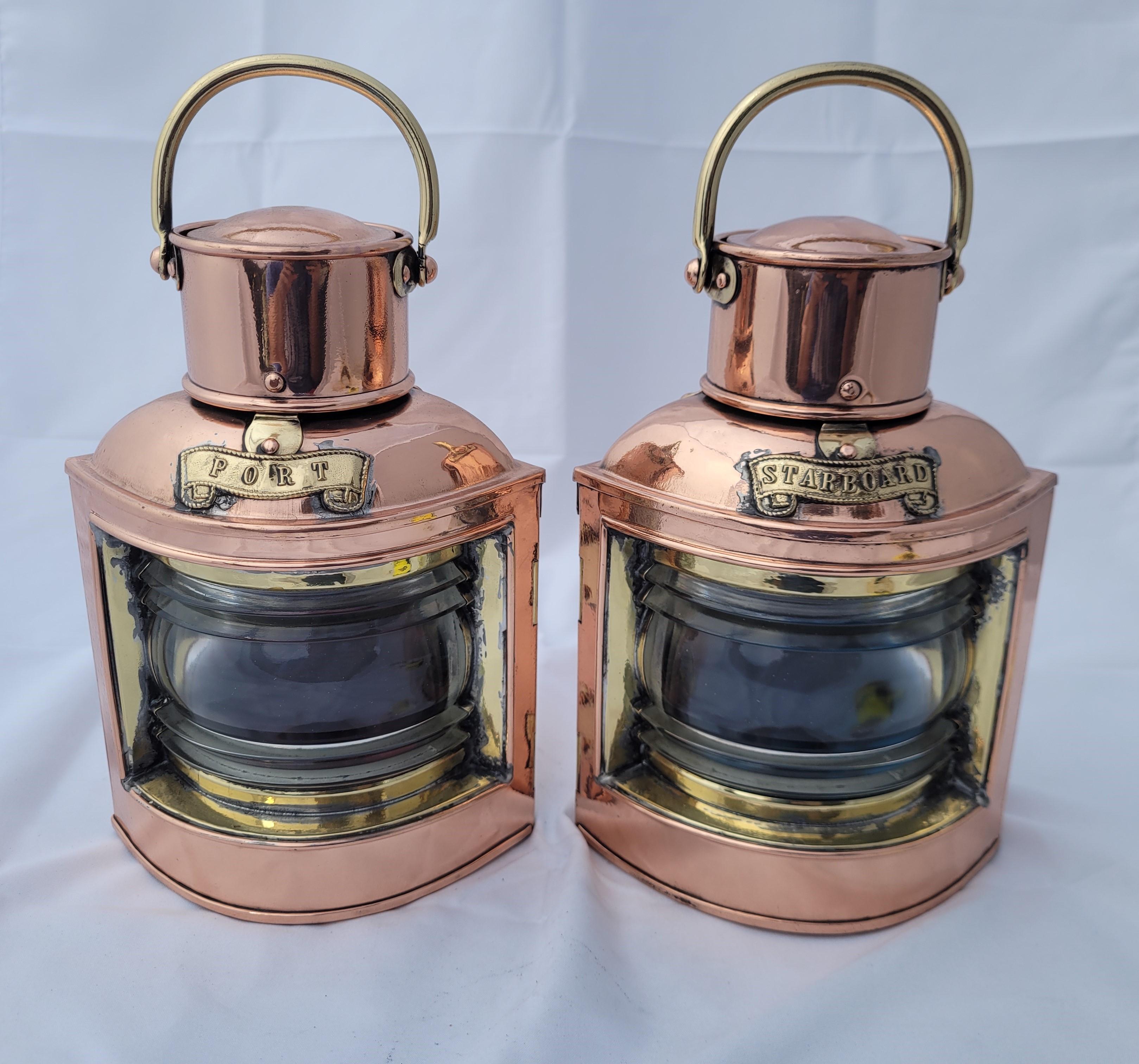 Pair of polished and lacquered port and starboard boat lanterns by Den Hann of Rotterdam Holland. Nice sturdy pair with clear Fresnel lenses in red and blue filters. With hinged rear doors, brass carry handles and mounting brackets. Den Hann was