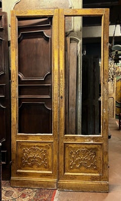 Glass door lacquered, gilded and with friezes, Italy