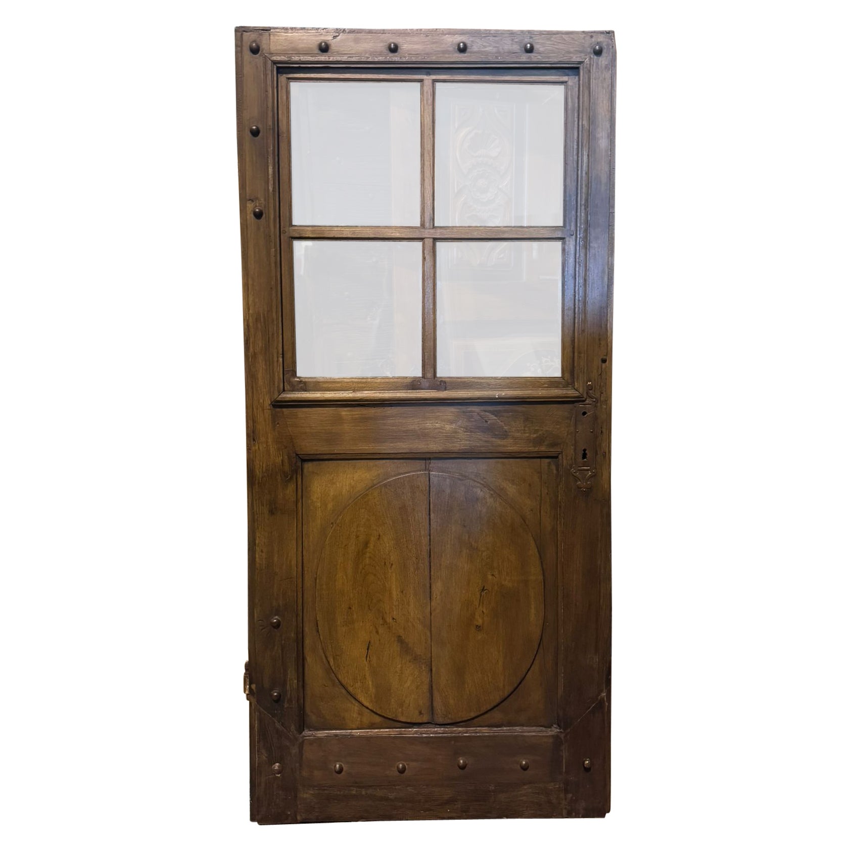 Porta ad un battente a vetri, in legno di noce con ferri originali, italia