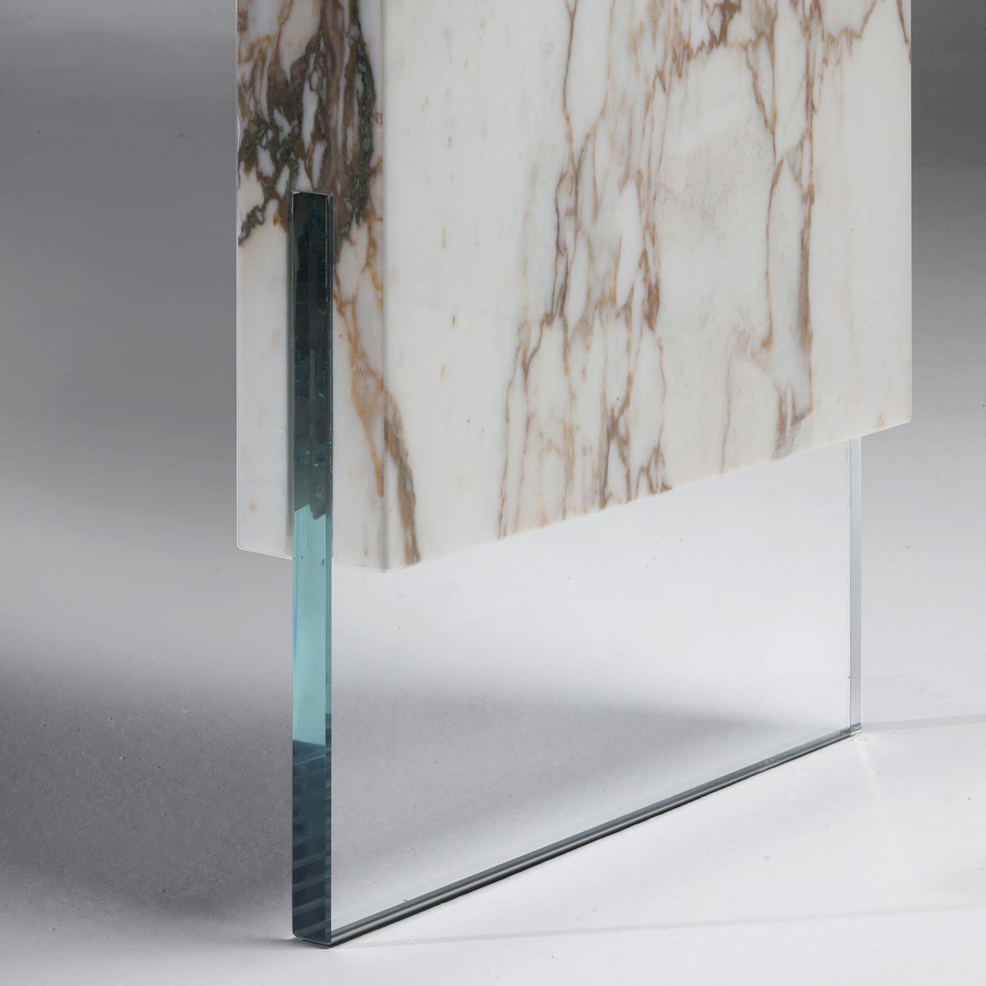 This superb, limited-edition console is a reinterpretation of classic furniture in its linear, essential volumes. A masterpiece that will captivate the imagination in a modern home, it is crafted using precious Calacatta Vagli Oro marble fashioned