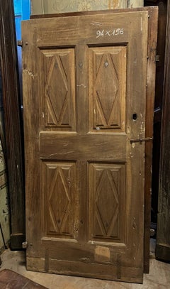 Carved solid walnut door with lozenge pattern, Italy