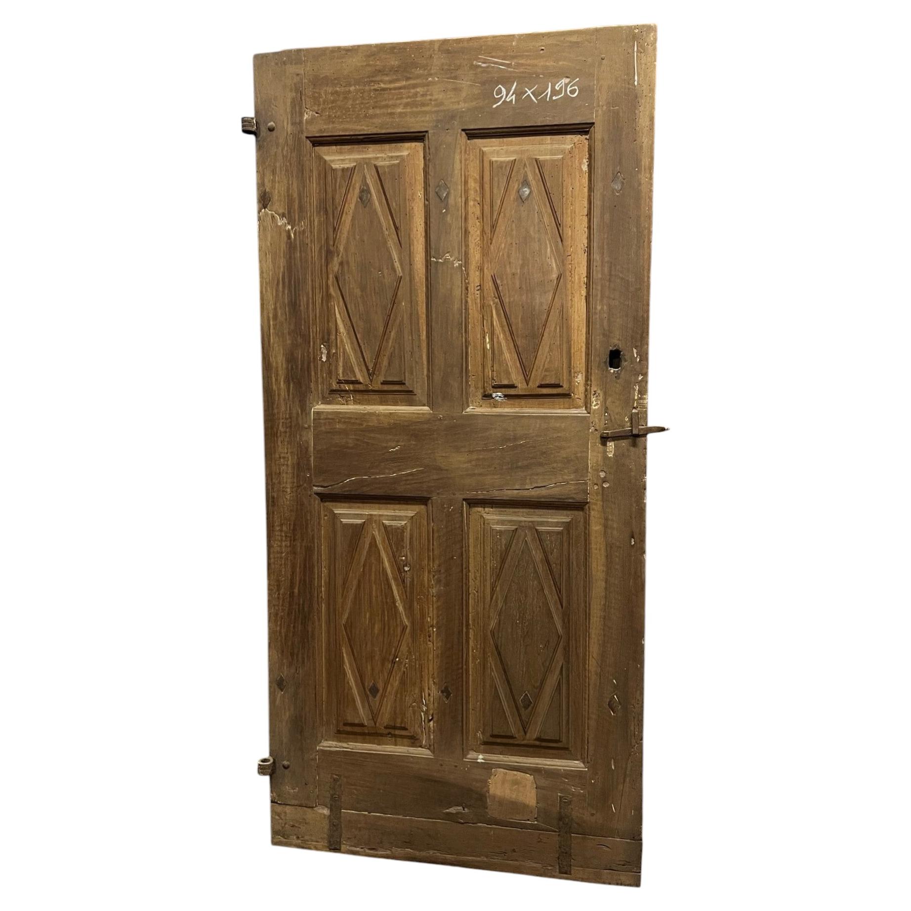 Carved solid walnut door with lozenge pattern, Italy