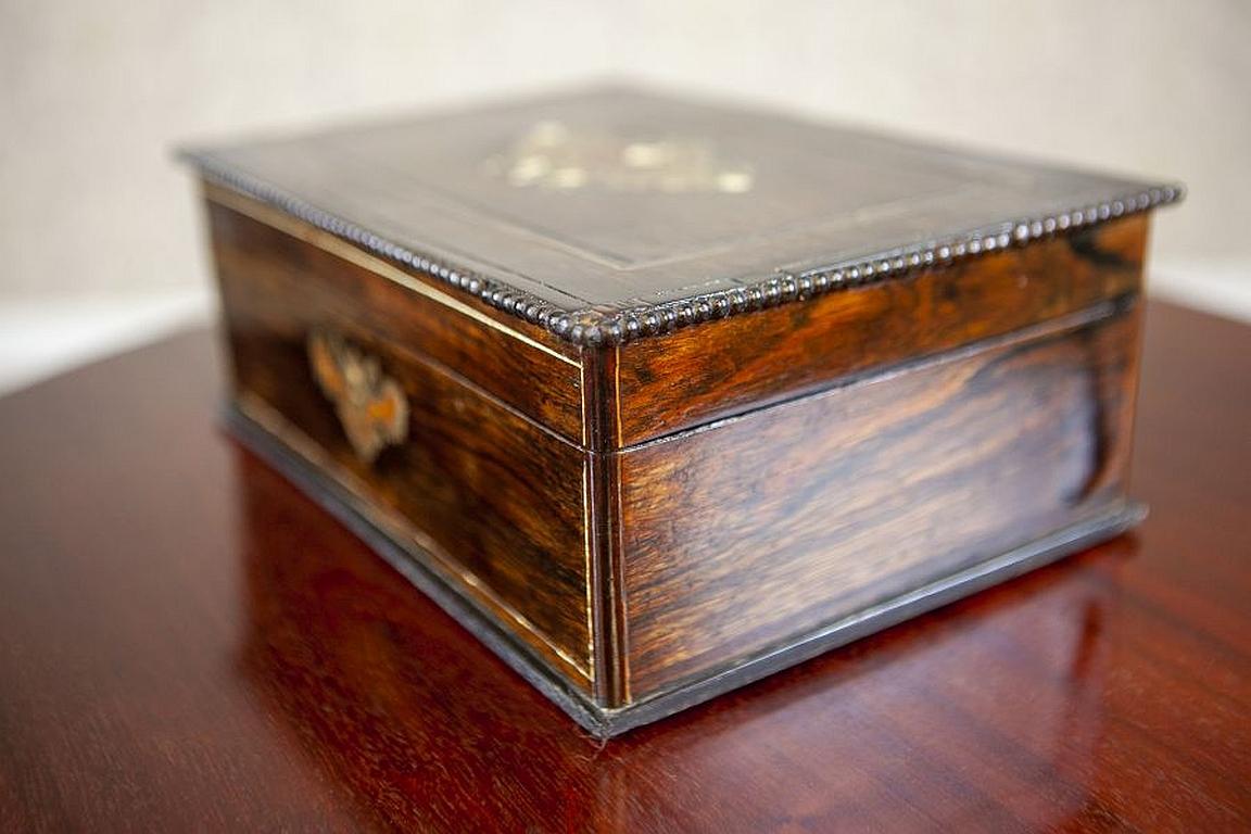 Richly Inlaid Portable Dressing Table from the 19th Century

We present you this richly inlaid portable dressing table, which can be locked with a key. The whole is from the end of 19th Century (ca. 1880). There are compartments, a mirror, and a