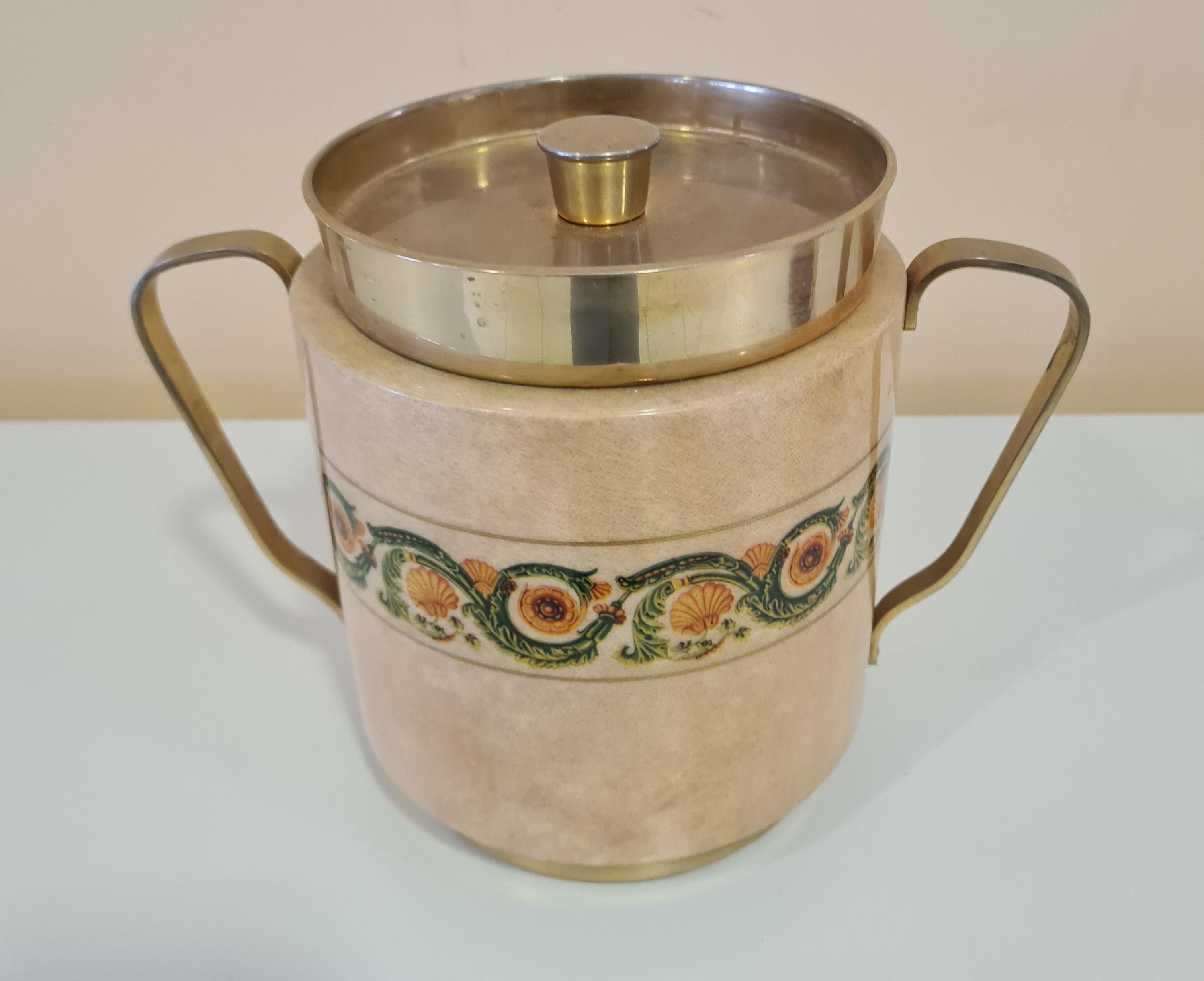 Ice box designed by designer Aldo Tura for Macabo.

Refined ice box made of parchment-covered wood with decorative brass details.

Aldo Tura was an Italian designer active since the 1930s, making furniture and accessories experiment with innovative