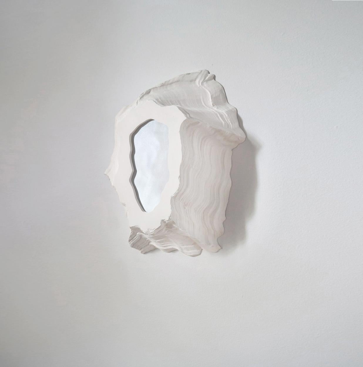 The Portals are a collection of wall mounted ceramic pieces, either illuminated or reflective. The irregular and highly textured objects evoke bleached coral, lava scars or even barnacles. The collection includes the four first versions of an
