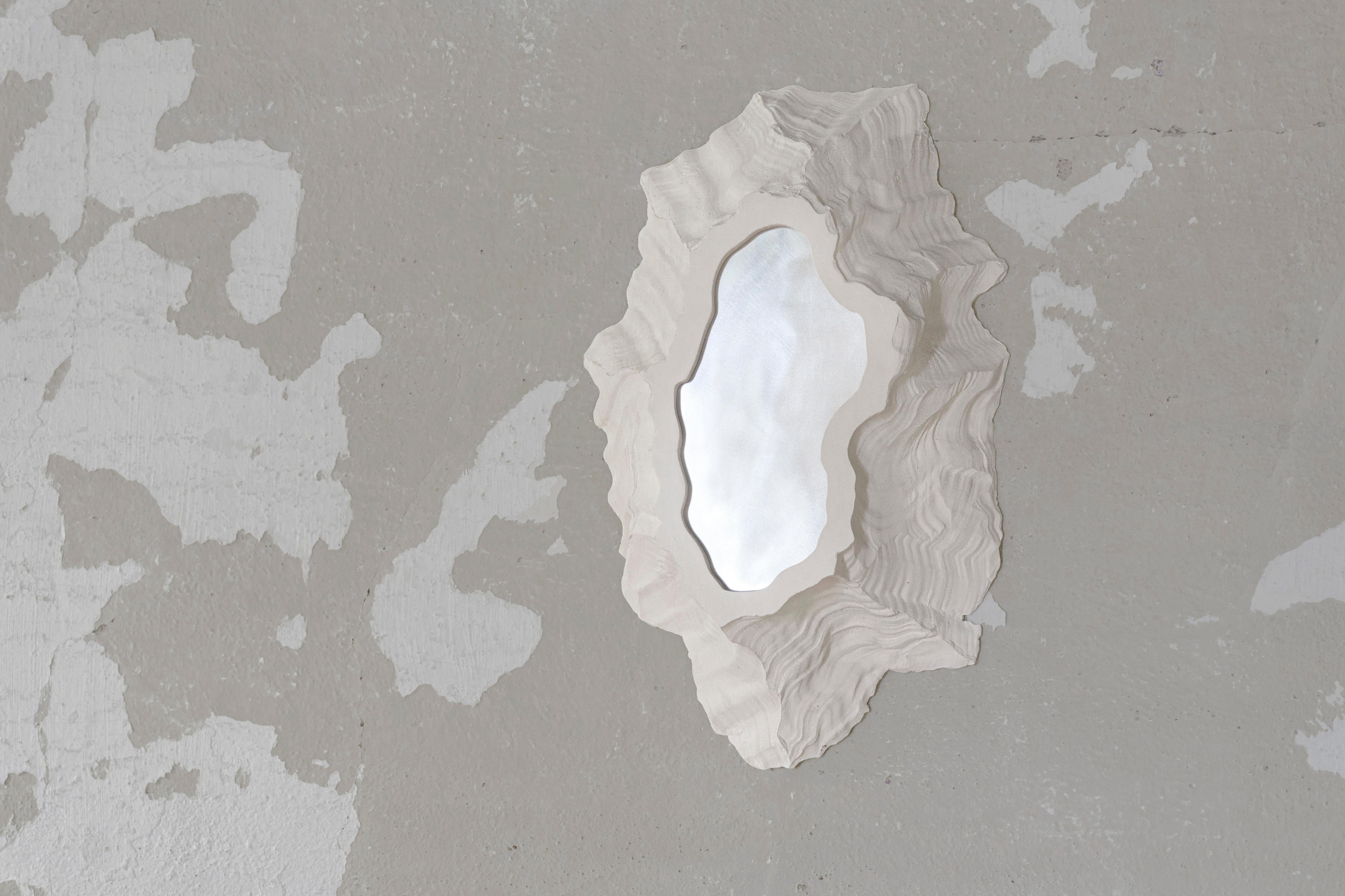 The Portals are a collection of wall mounted ceramic pieces, either illuminated or reflective. The irregular and highly textured objects evoke bleached coral, lava scars or even barnacles. The collection includes the four first versions of an