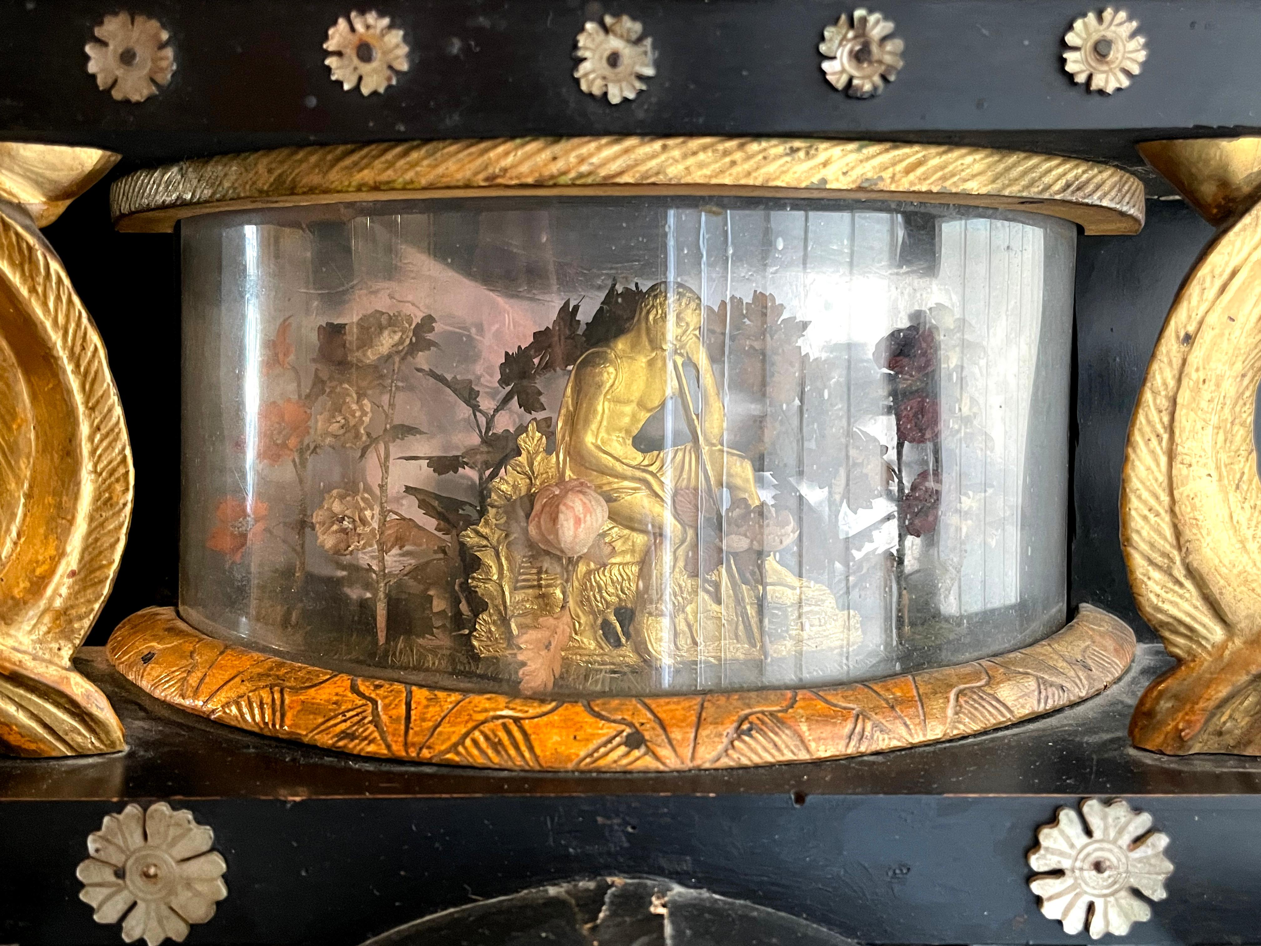 Portal clock Vienna around 1825 with integrated musical mechanism

Signed: “A.Olbrich in Wien” and number 215719157.

Alabaster columns, blackened wood, gilded carving in the form of birds and a raised lion at the end.
Figural bronze of a shepherd
