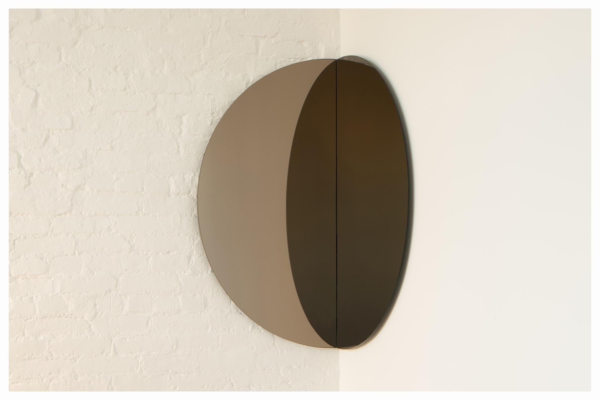 Portal mirror by Jude Di Leo
Dimensions: 
21”W x 21”W x 42”H 
36”W x 36”W x 72”H 
Materials: Bronze mirror, hidden wall cleat.
With or without dimmable LED backlight. 

The reflecting mirror-on-mirror gives Portal the illusion of a gateway into