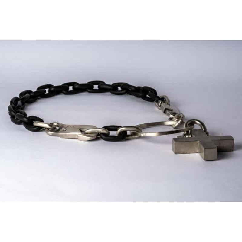 Chain necklace made of wood and bronze. All organic chain is carved by hand. In the case of the chains made of wood, they are absolutely seamless; carved from a single long slab of wood (see link). 
The Charm System is an interrelated group of